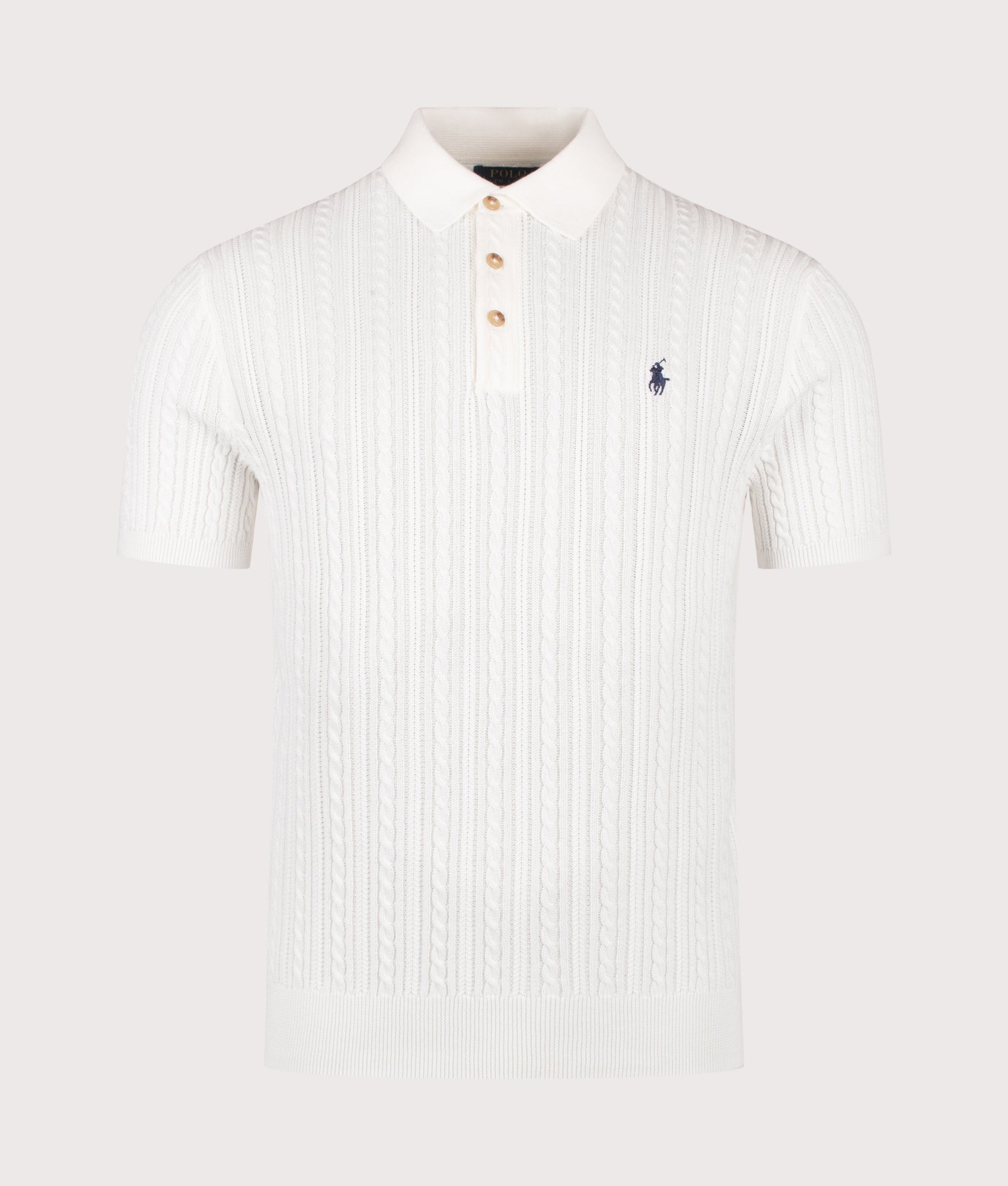 Cable Knit Polo Shirt in Deckwash White by Polo Ralph Lauren. Shot by EQVVS. Front shot.