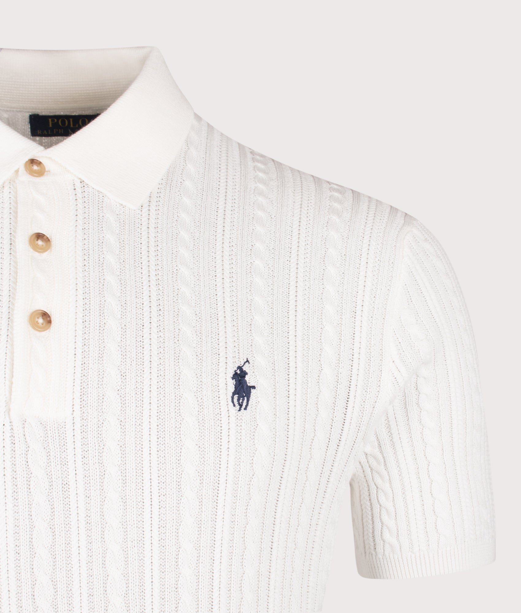Cable Knit Polo Shirt in Deckwash White by Polo Ralph Lauren. Shot by EQVVS. Detail shot.