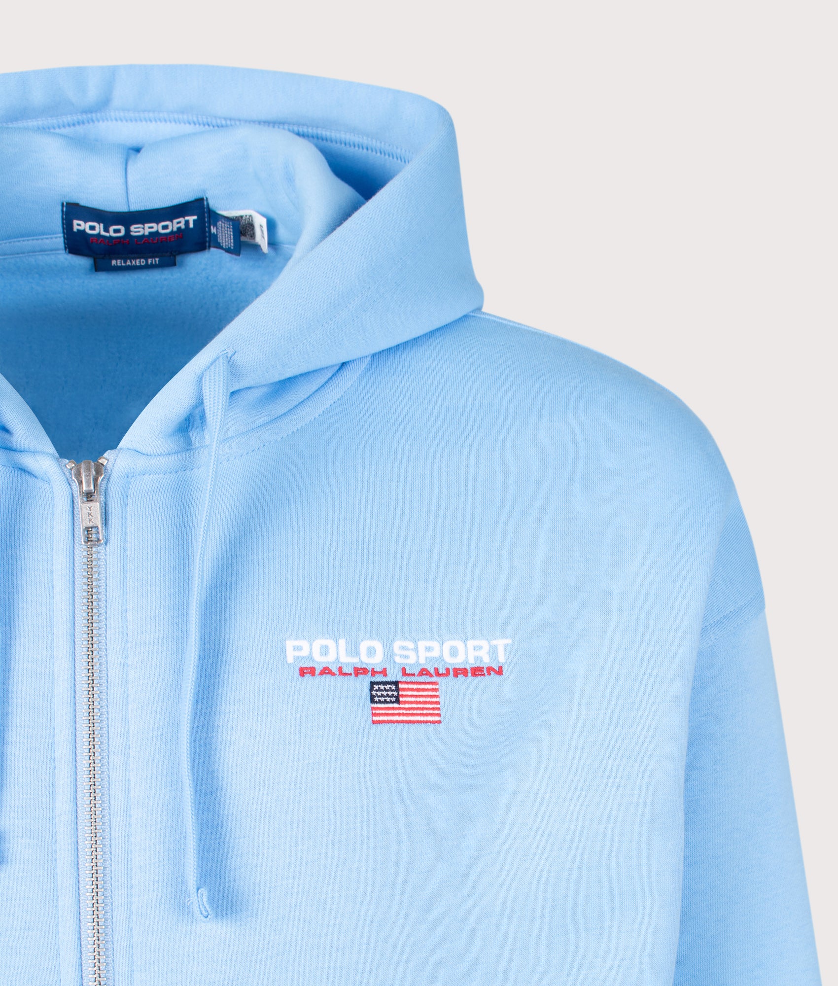 Polo Ralph Lauren Relaxed Fit Polo Sport Flag Logo Hoodie in Chatham Blue at EQVVS Menswear. Detail shot.
