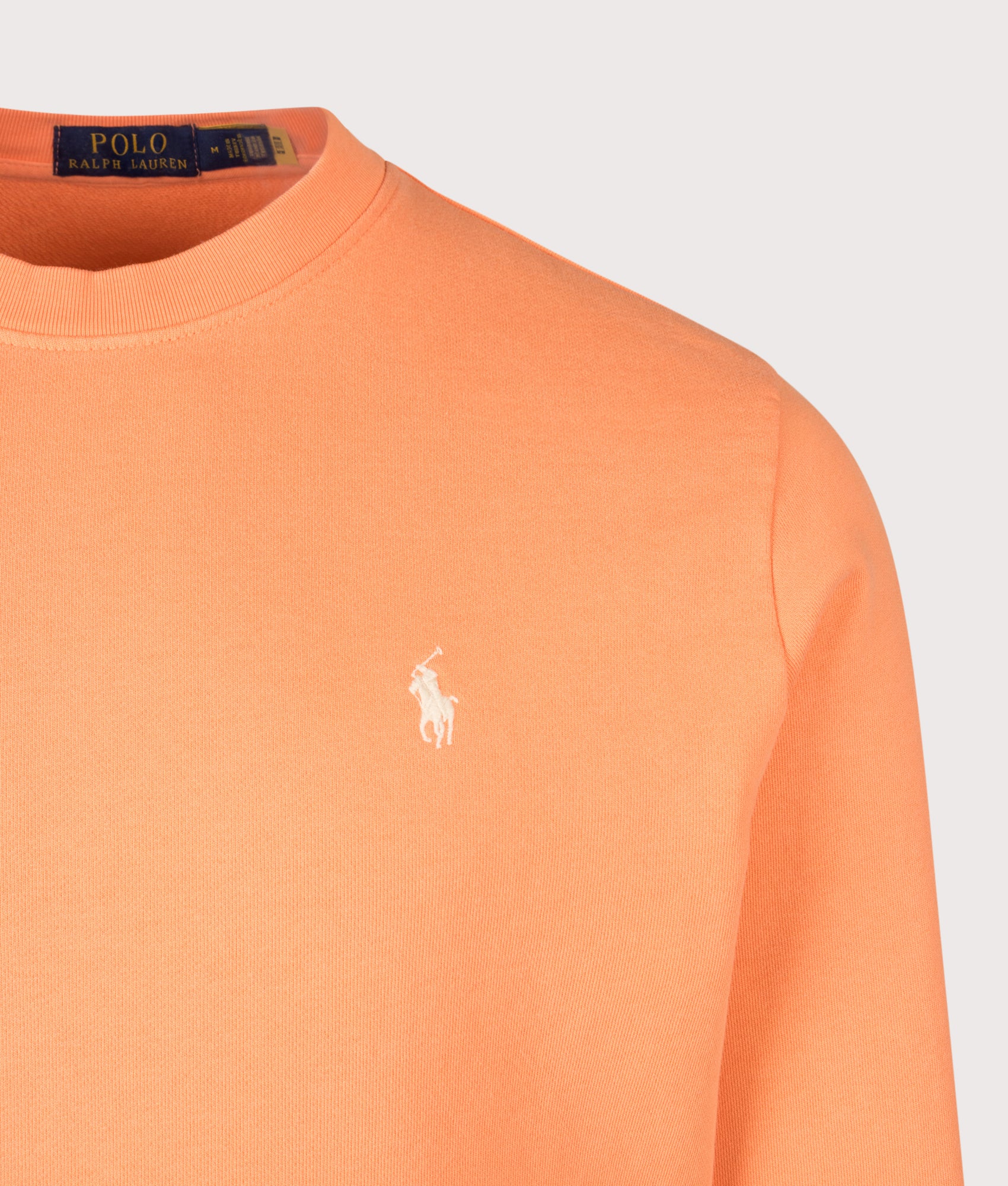 Loopback Terry Sweatshirt in Pompano Orange by Polo Ralph Lauren. Shot by EQVVS. Detail shot.
