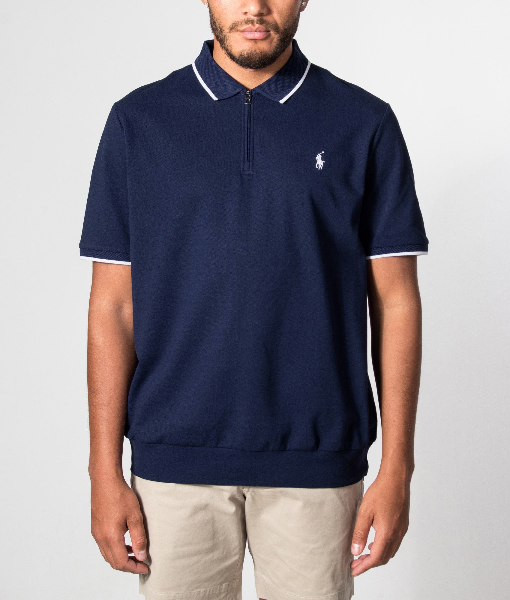 Polo Ralph Lauren Classic Fit Stretch Mesh Zip Polo Shirt in Newport Navy at EQVVS Menswear. Model front shot.
