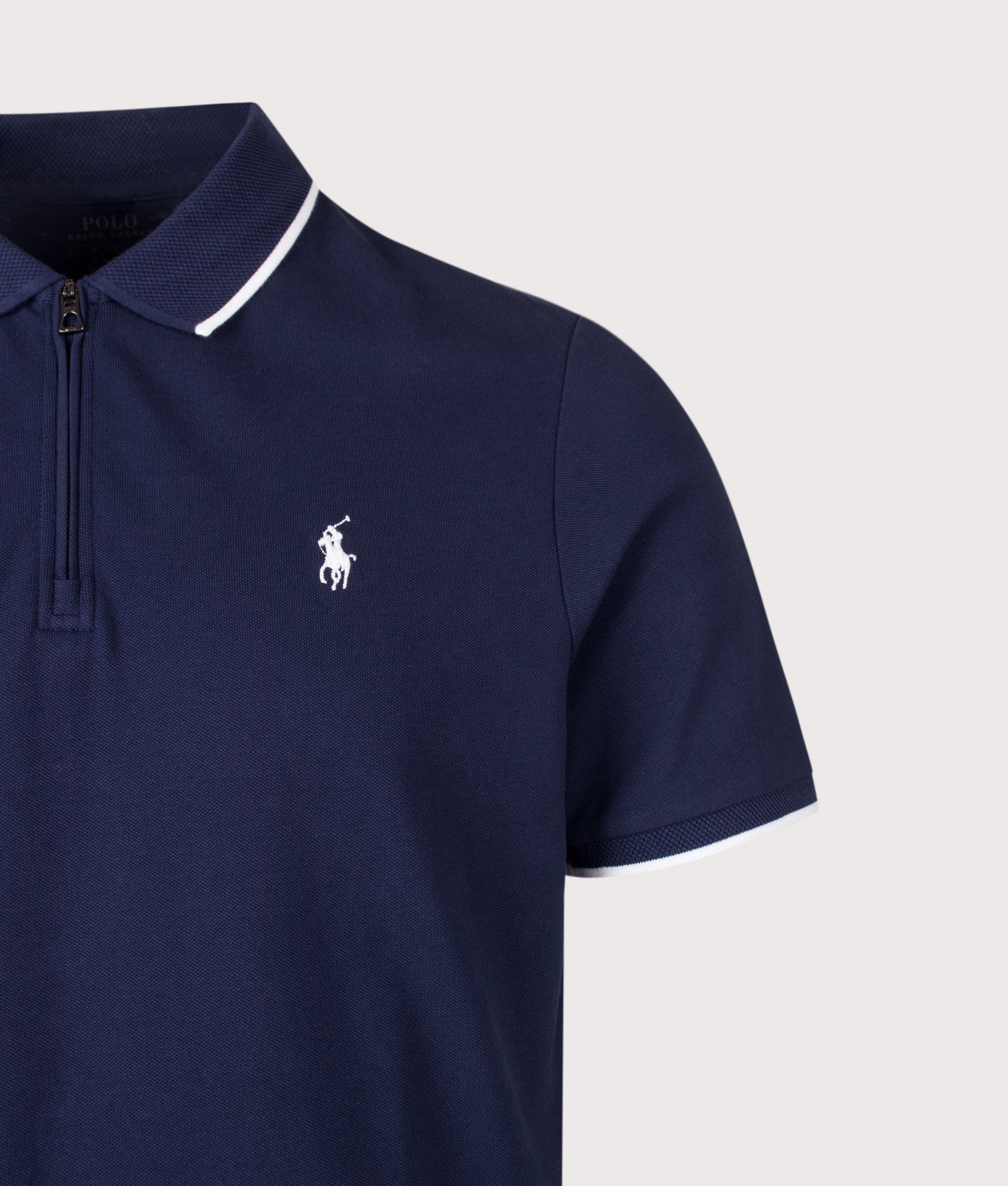 Polo Ralph Lauren Classic Fit Stretch Mesh Zip Polo Shirt in Newport Navy at EQVVS Menswear. Detail shot.