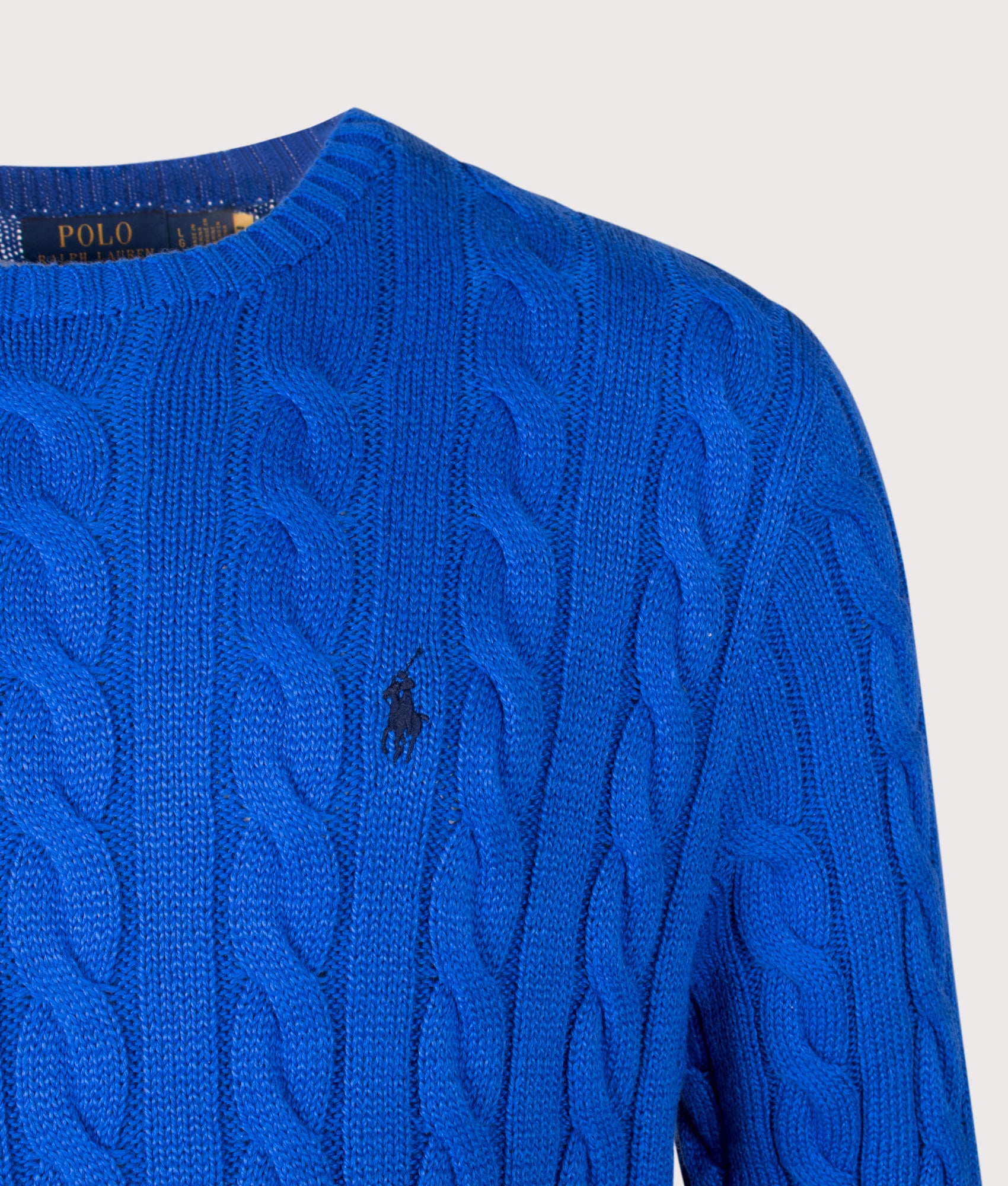 Polo Ralph Lauren Regular Fit Cable Knit Cotton Jumper in New Iris Blue at EQVVS Menswear. Detail shot.
