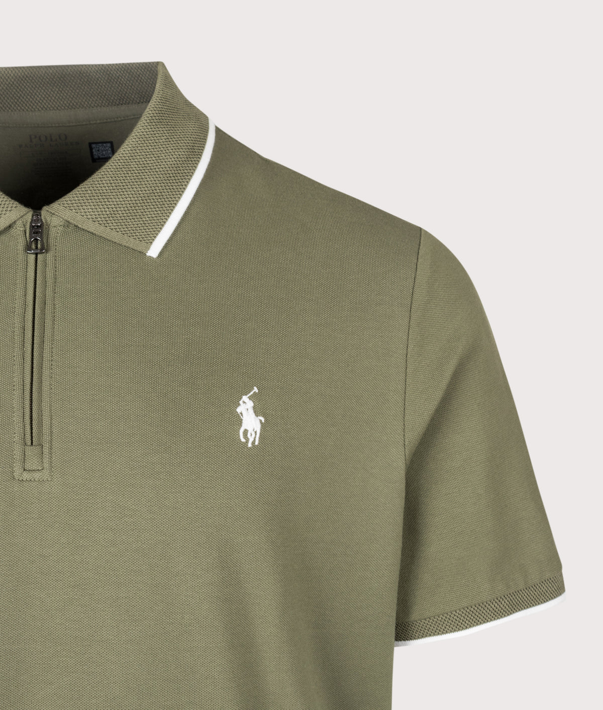 Polo Ralph Lauren Classic Fit Stretch Mesh Zip Polo Shirt in Cruise Olive at EQVVS Menswear. Detail shot.