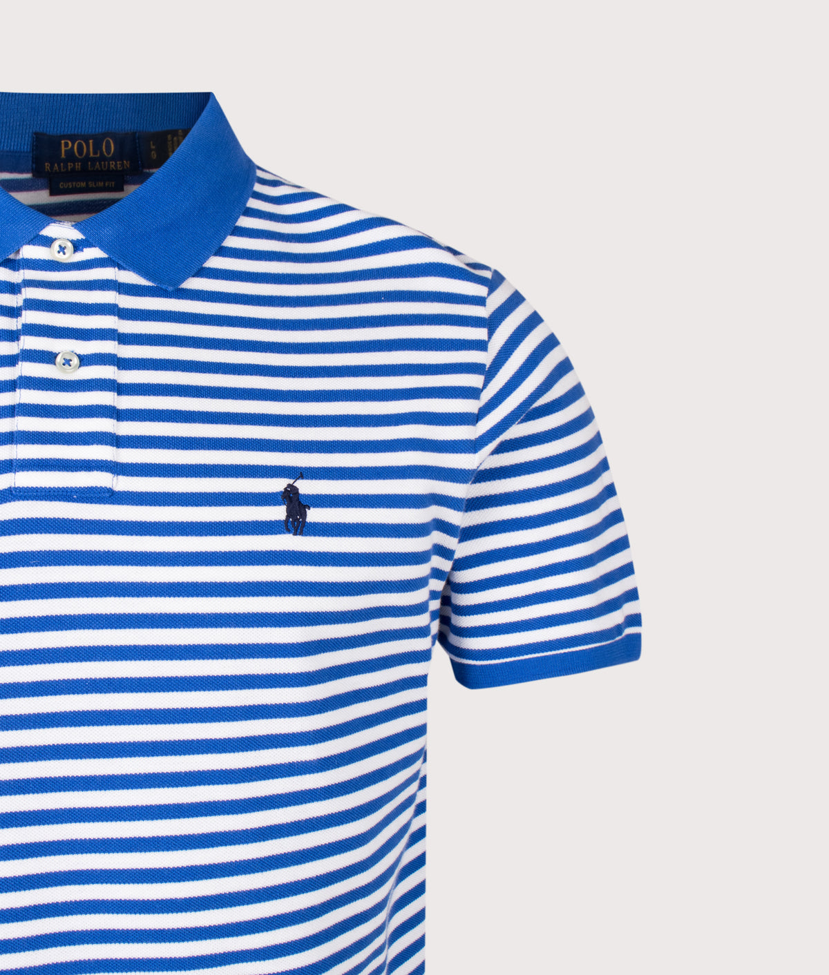 Polo Ralph Lauren Custom Slim Fit Striped Mesh Polo Shirt in New Iris Blue and White at EQVVS Menswear. Detail shot.