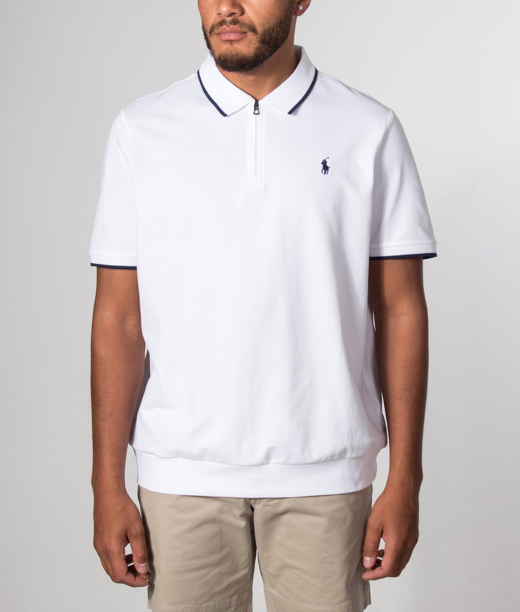 Polo Ralph Lauren Classic Fit Stretch Mesh Zip Polo Shirt in White at EQVVS Menswear. Model front shot.
