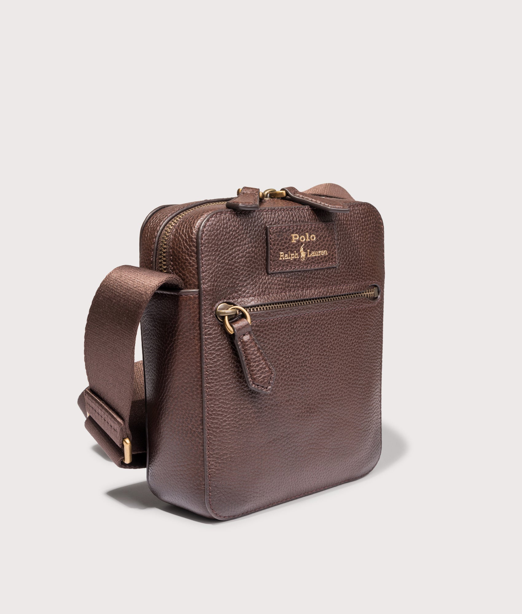 Polo Ralph Lauren Pebbled Leather Crossbody Bag in Dark Brown at EQVVS Menswear. Angled front shot.
