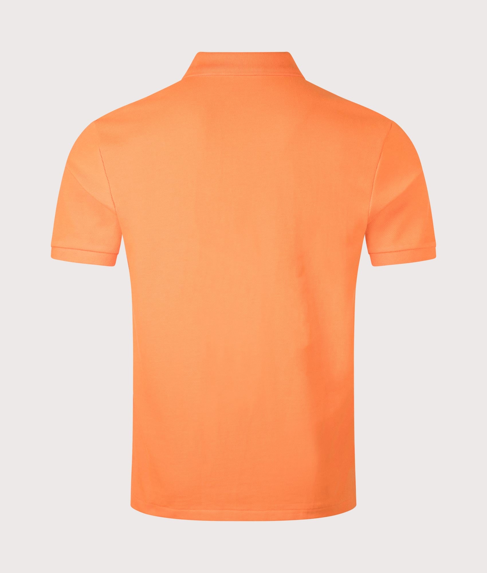 Custom Slim Fit Mesh Polo Shirt in Bedford Orange by Polo Ralph Lauren. Shot by EQVVS. Back shot.