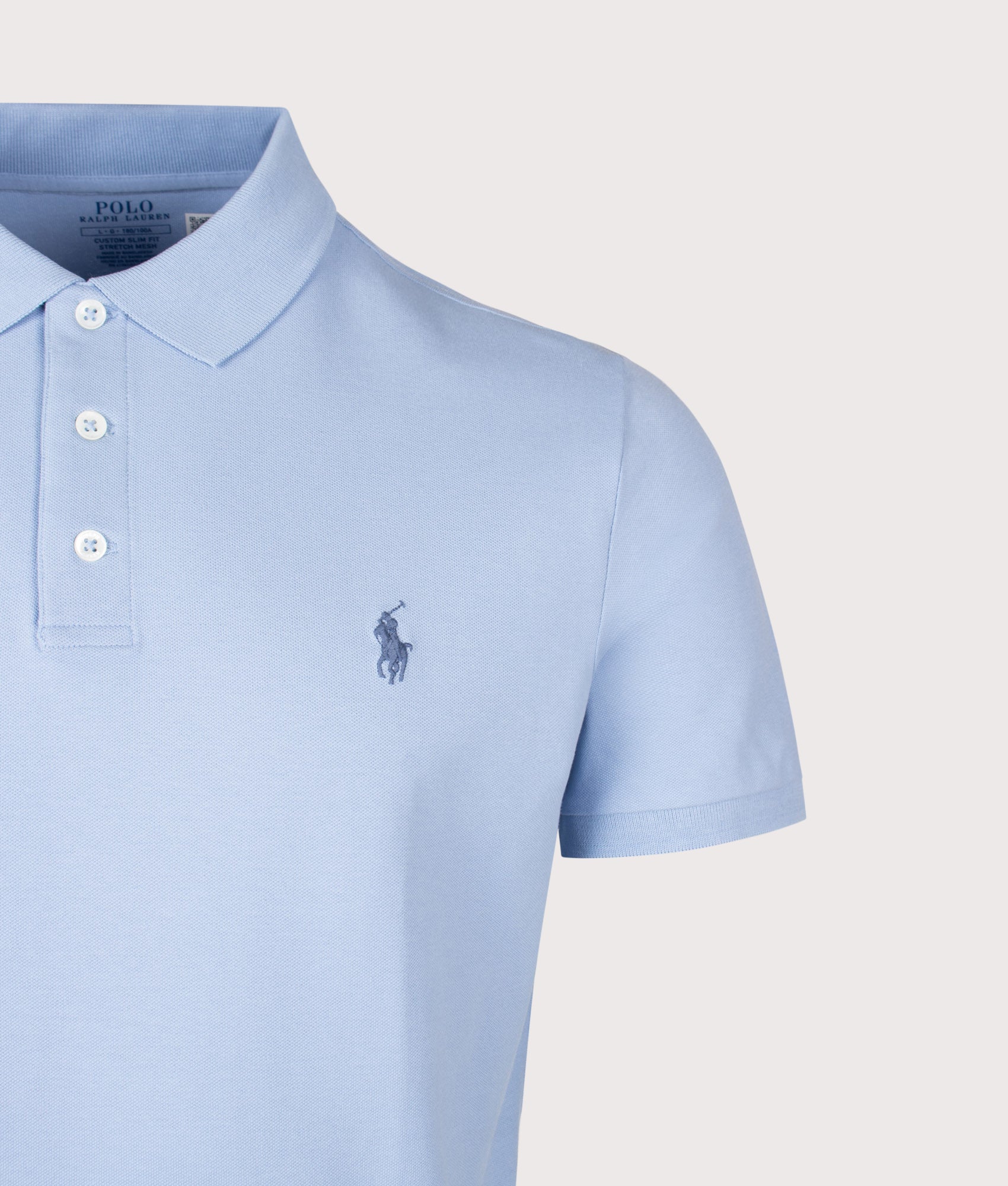 Polo Ralph Lauren Custom Slim Fit Stretch Mesh Polo Shirt in Chambray Blue at EQVVS Menswear. Detail shot.