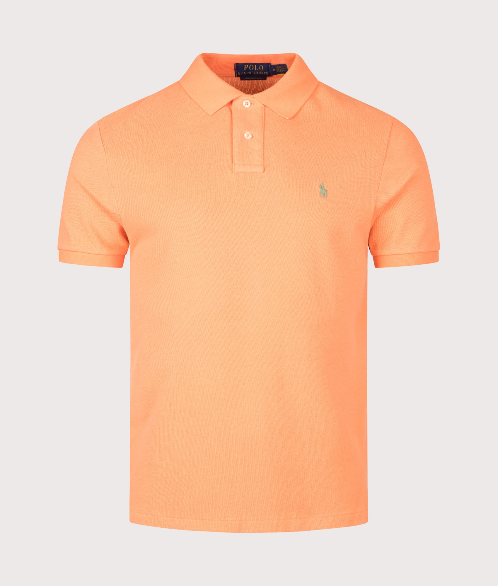Custom Slim Fit Mesh Polo Shirt in Orange by Polo Ralph Lauren. Shot by EQVVS. Front shot.