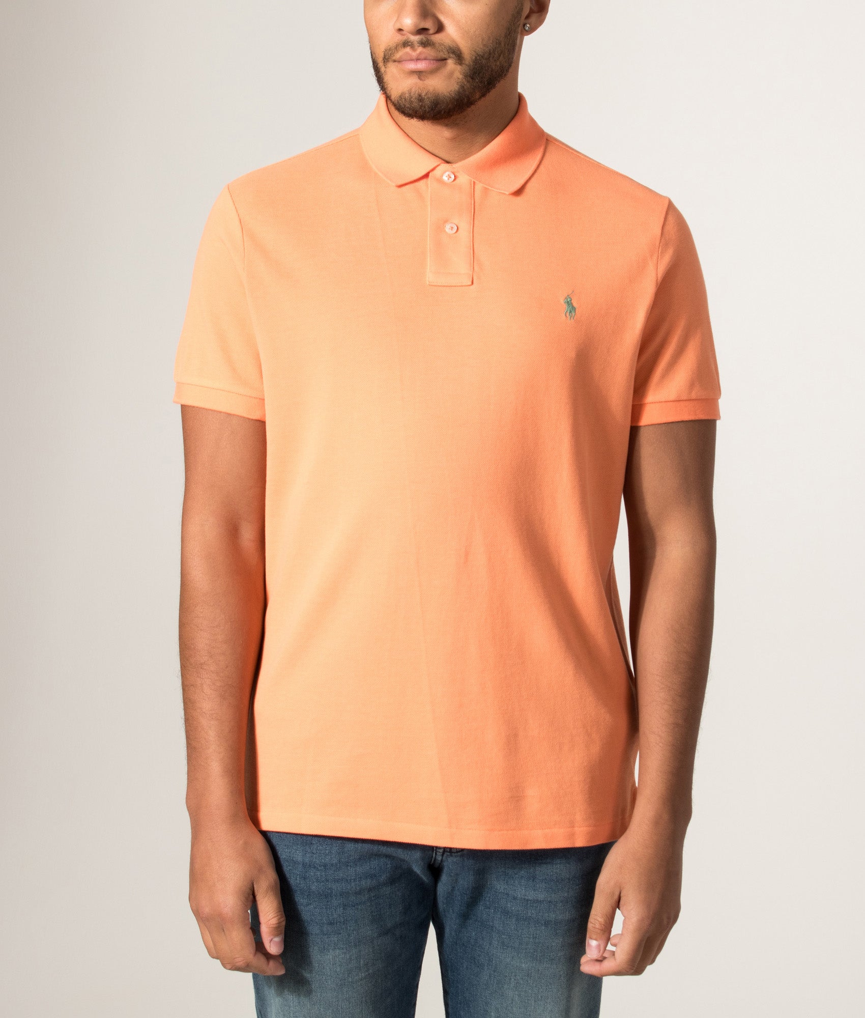 Custom Slim Fit Mesh Polo Shirt in Orange by Polo Ralph Lauren. Shot by EQVVS. Model front shot.