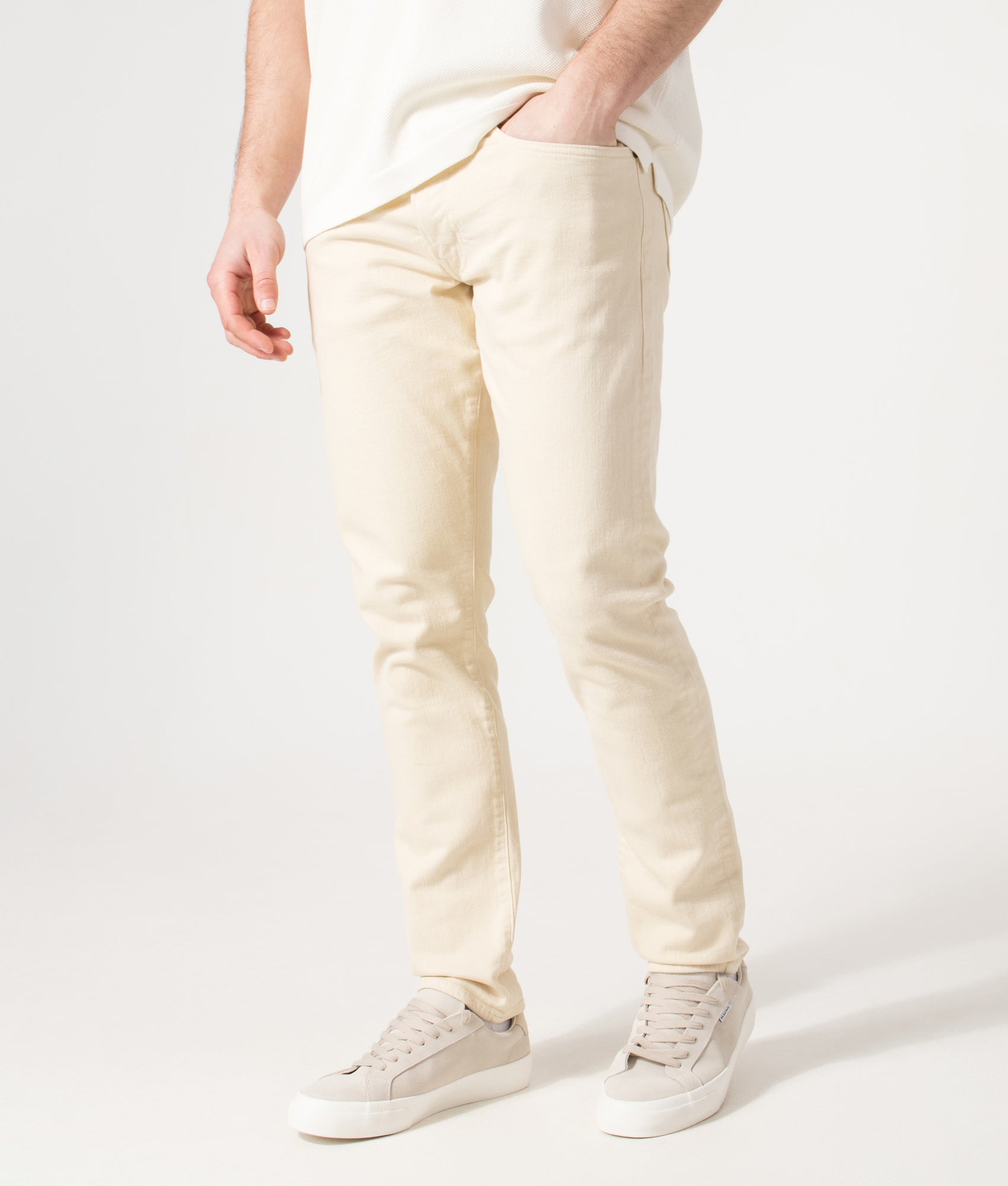 Polo Ralph Lauren Slim Fit Sullivan Stretch Jeans in Andover Cream at EQVVS Menswear. Angled model front shot.