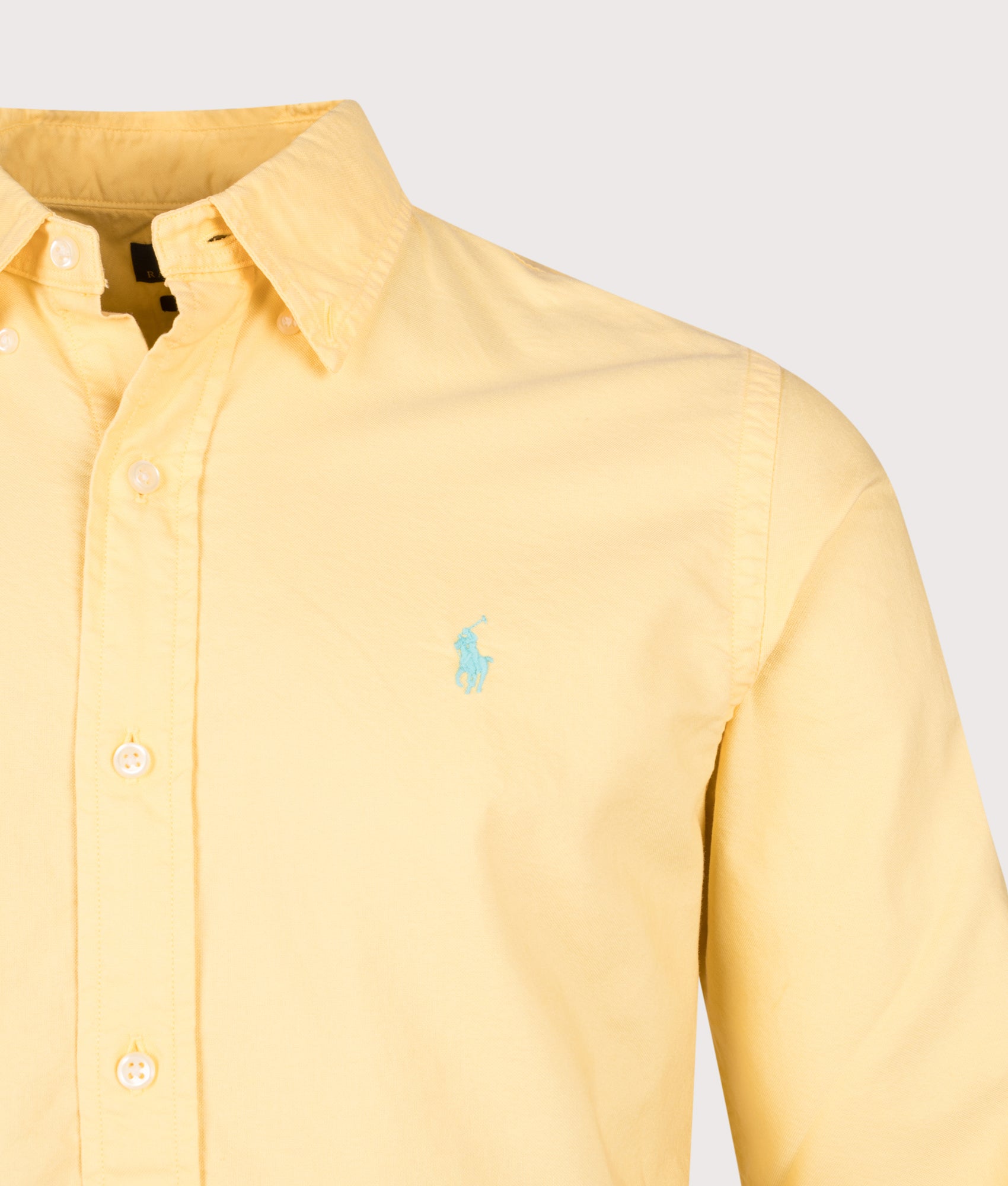 Polo Ralph Lauren Custom Fit Garment-Dyed Oxford Shirt in Corn Yellow at EQVVS Menswear. Detail shot.