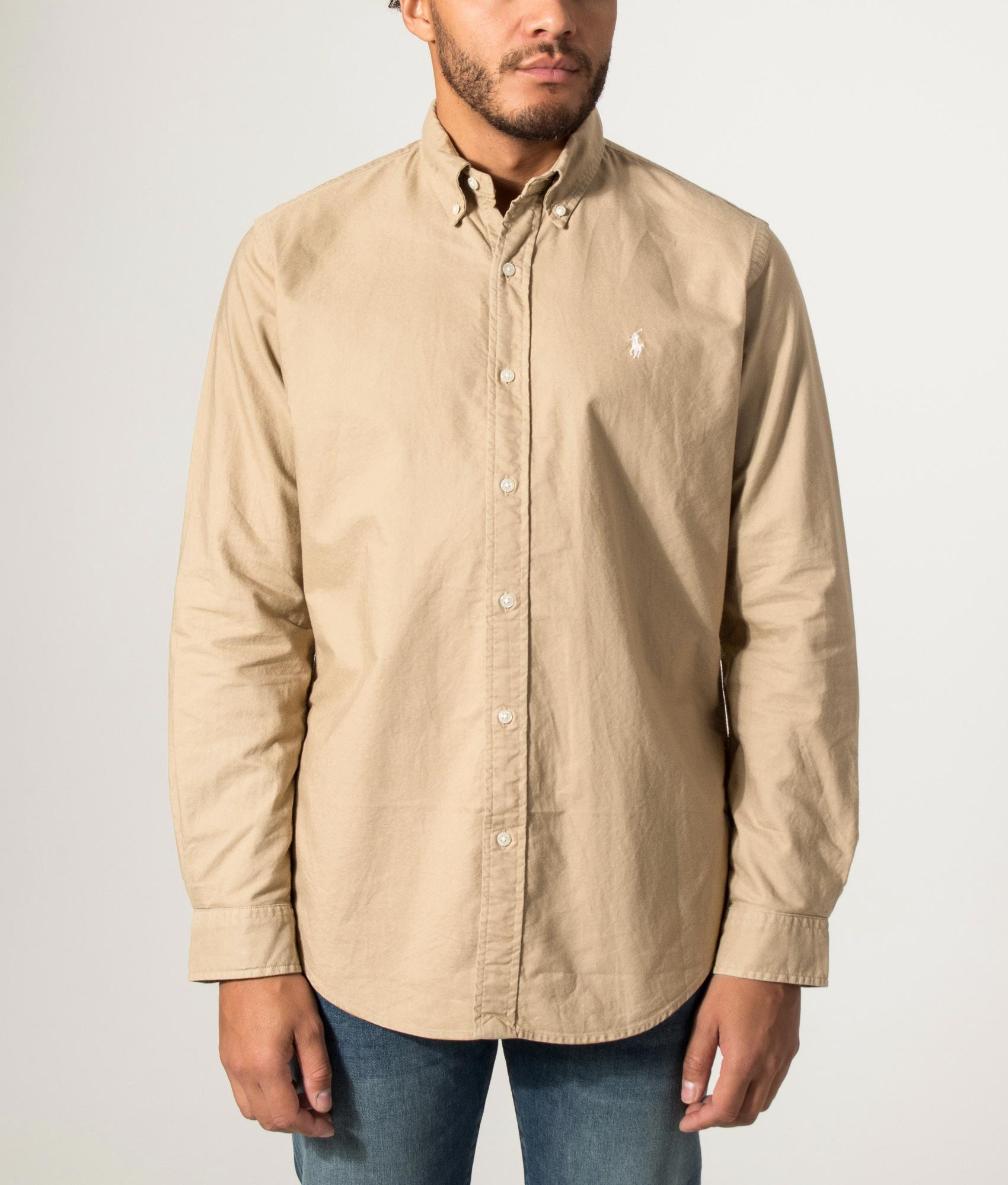 Polo Ralph Lauren Custom Fit Garment-Dyed Oxford Shirt in Cafe Tan at EQVVS Menswear. Model front shot.
