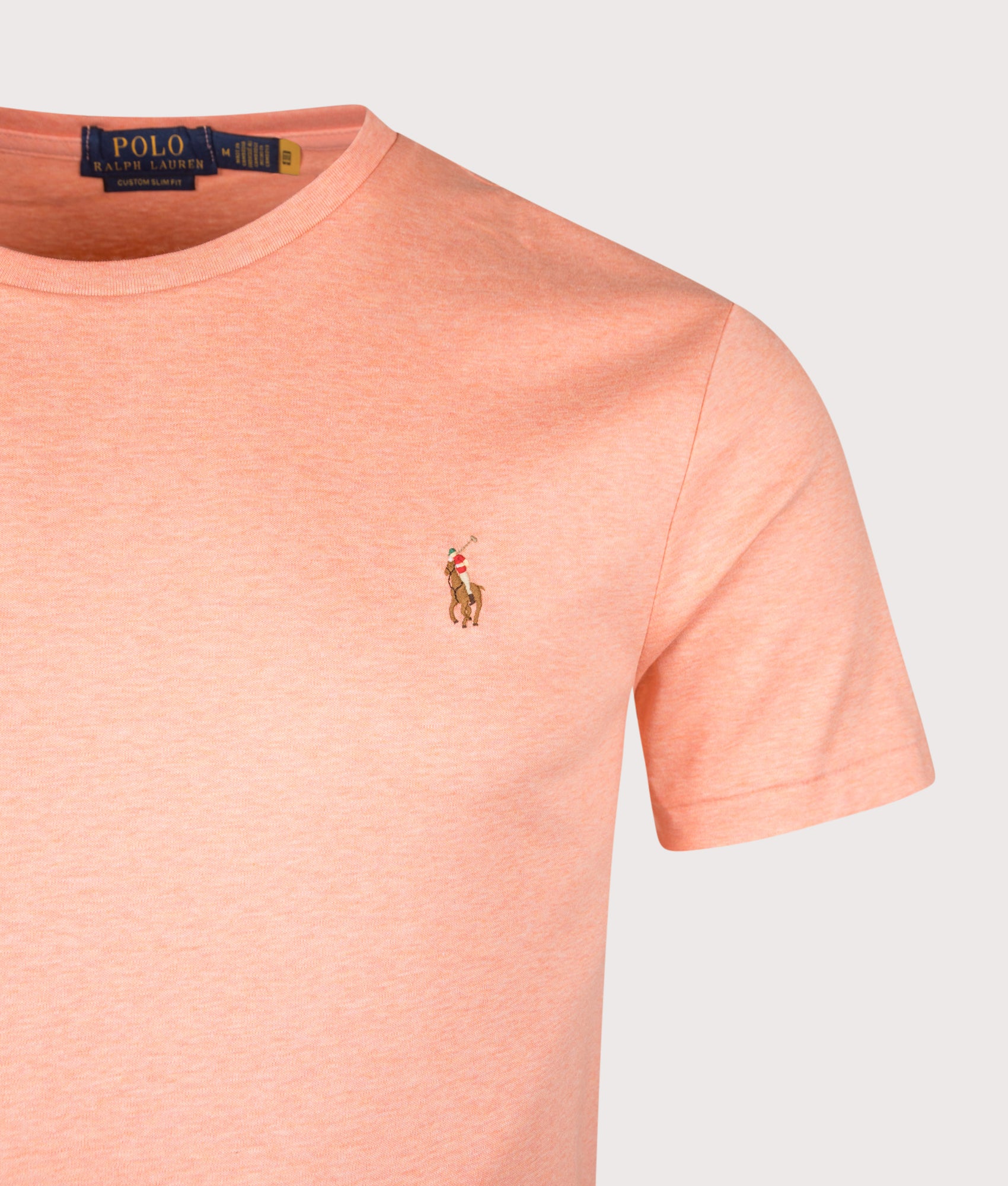 Custom Slim Fit Pima T-Shirt in Soft Orange Heather by Polo Ralph Lauren. Shot by EQVVS. Detail Shot.