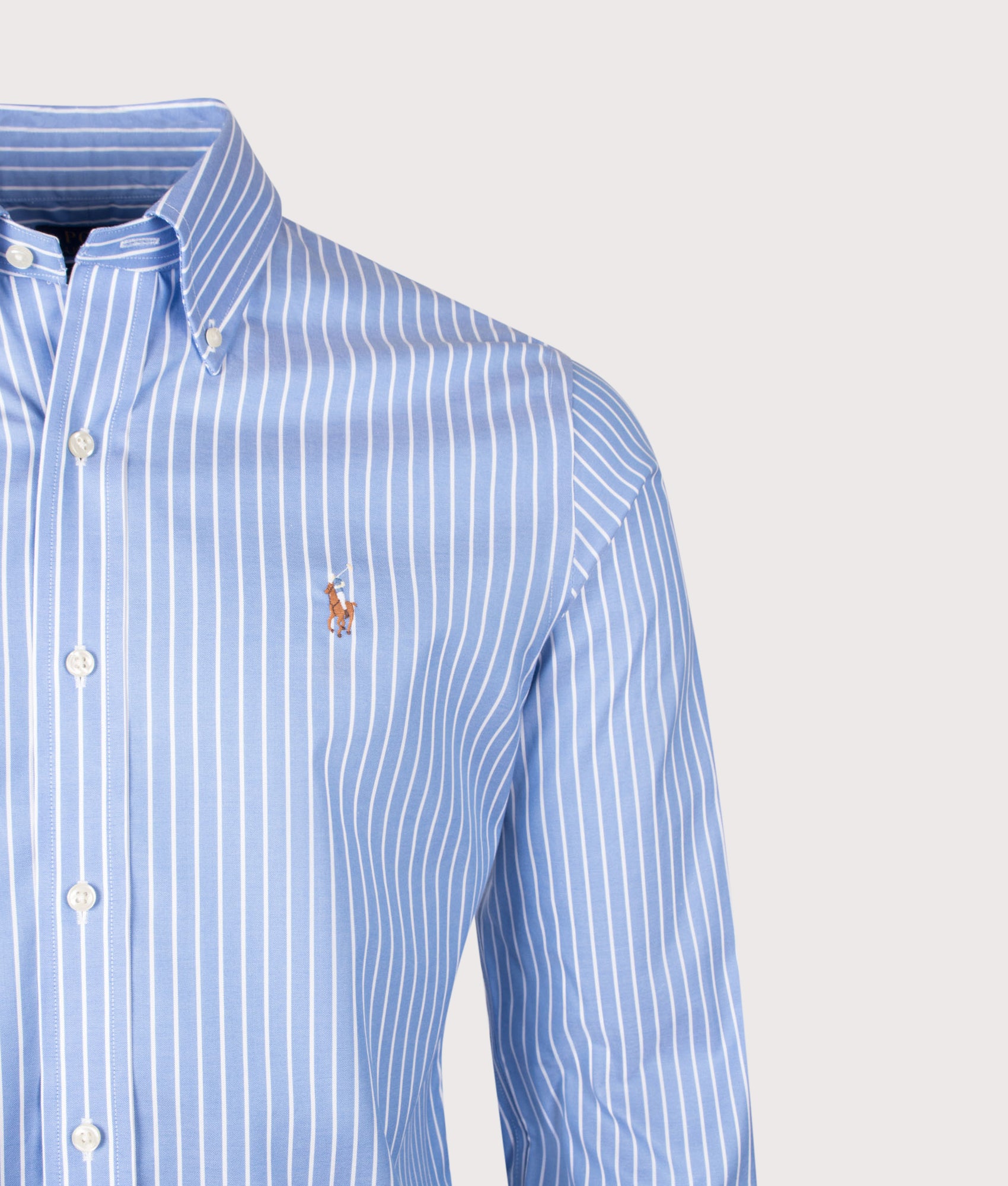 Polo Ralph Lauren Custom Fit Striped Pinpoint Oxford Shirt in Azure and White stripe at EQVVS Menswear. Detail shot.