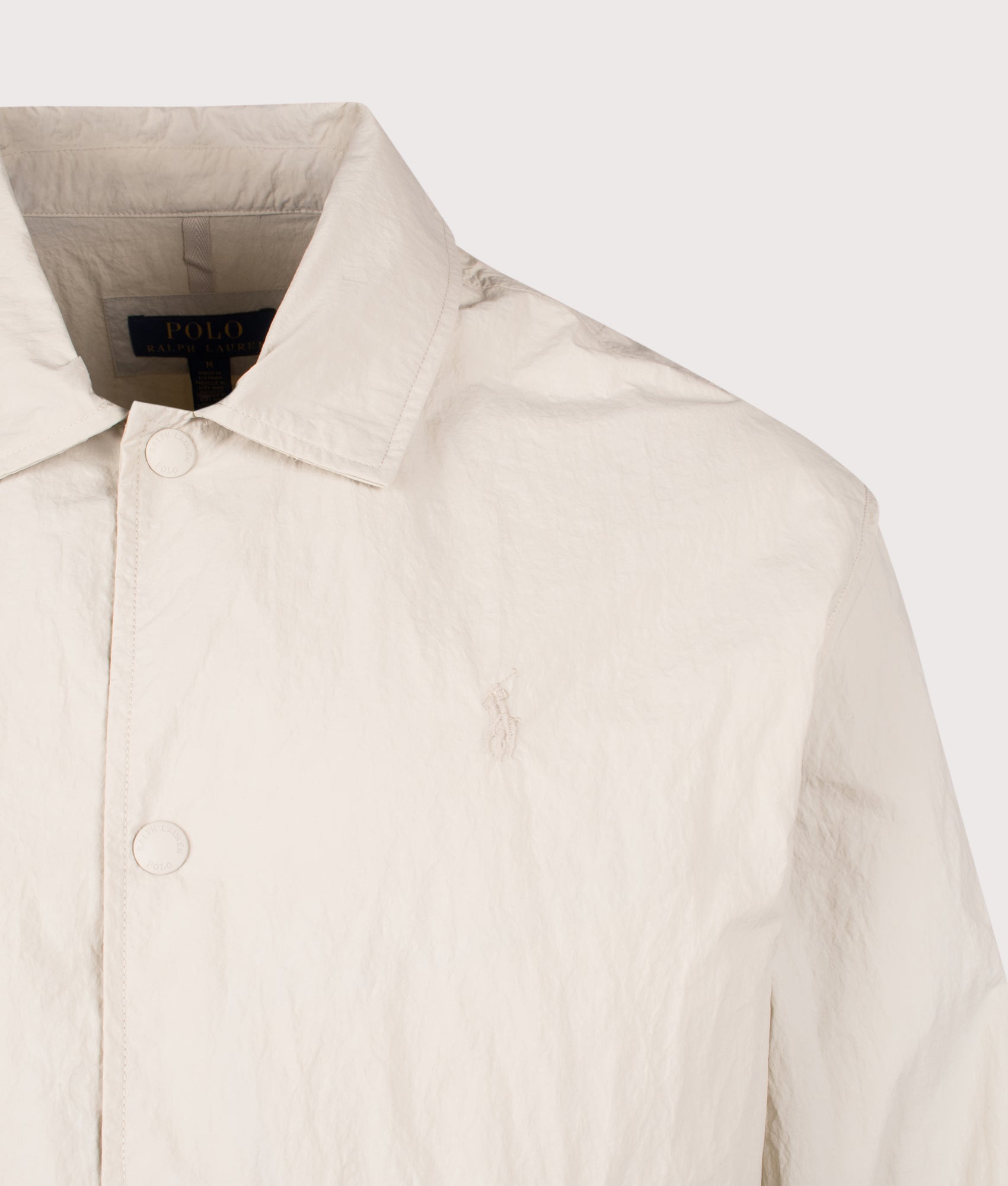 Polo Ralph Lauren The Hayford Coach's Windbreaker Jacket in Basic Sand at EQVVS Menswear. Detail shot.