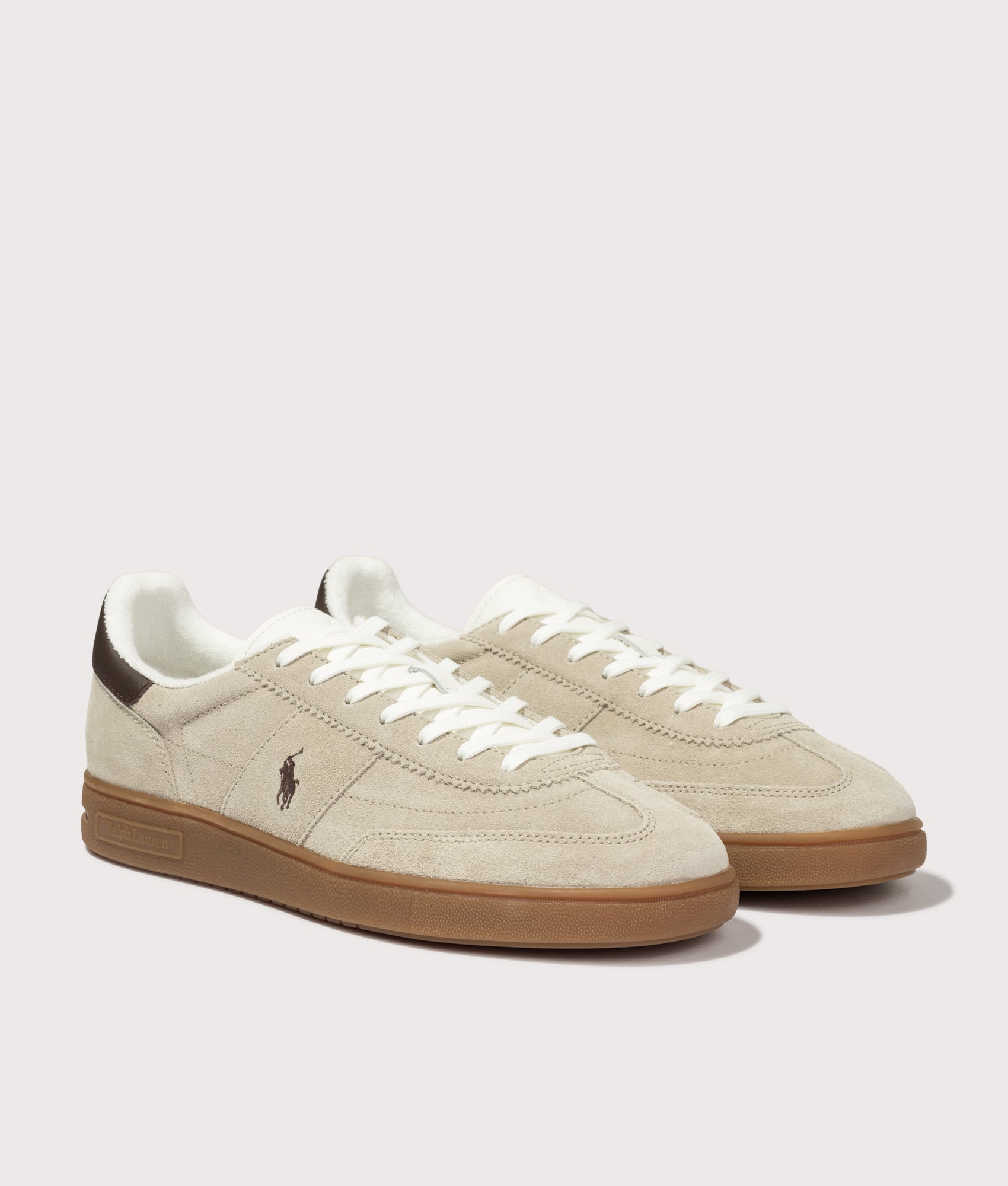 Polo Ralph Lauren Bedford Suede Sneakers in Milkshake and Dark Brown at EQVVS Menswear. Angled front shot.