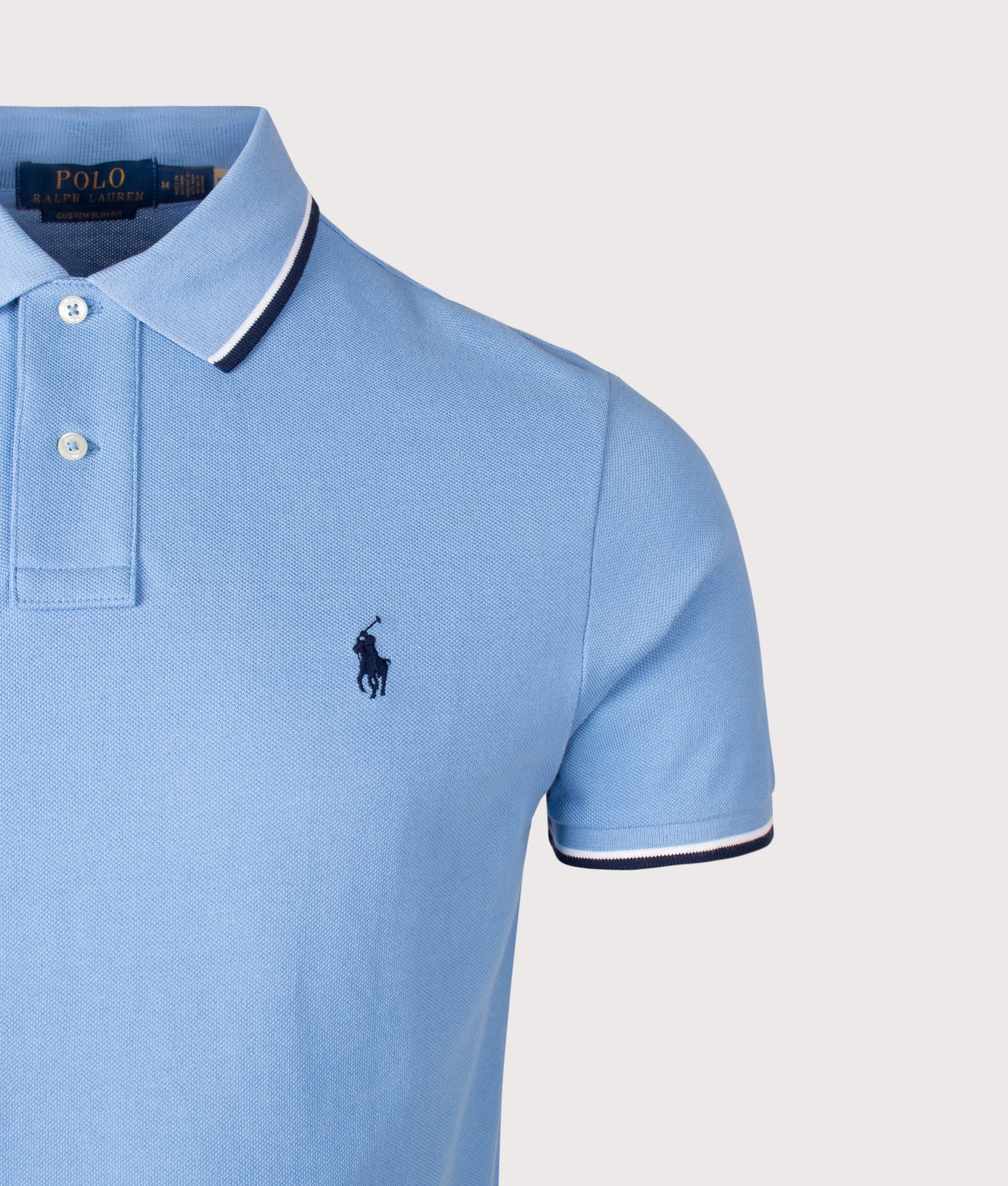Custom Slim Fit Mesh Polo Shirt in Blue by Polo Ralph Lauren. Shot by EQVVS. Detail shot.