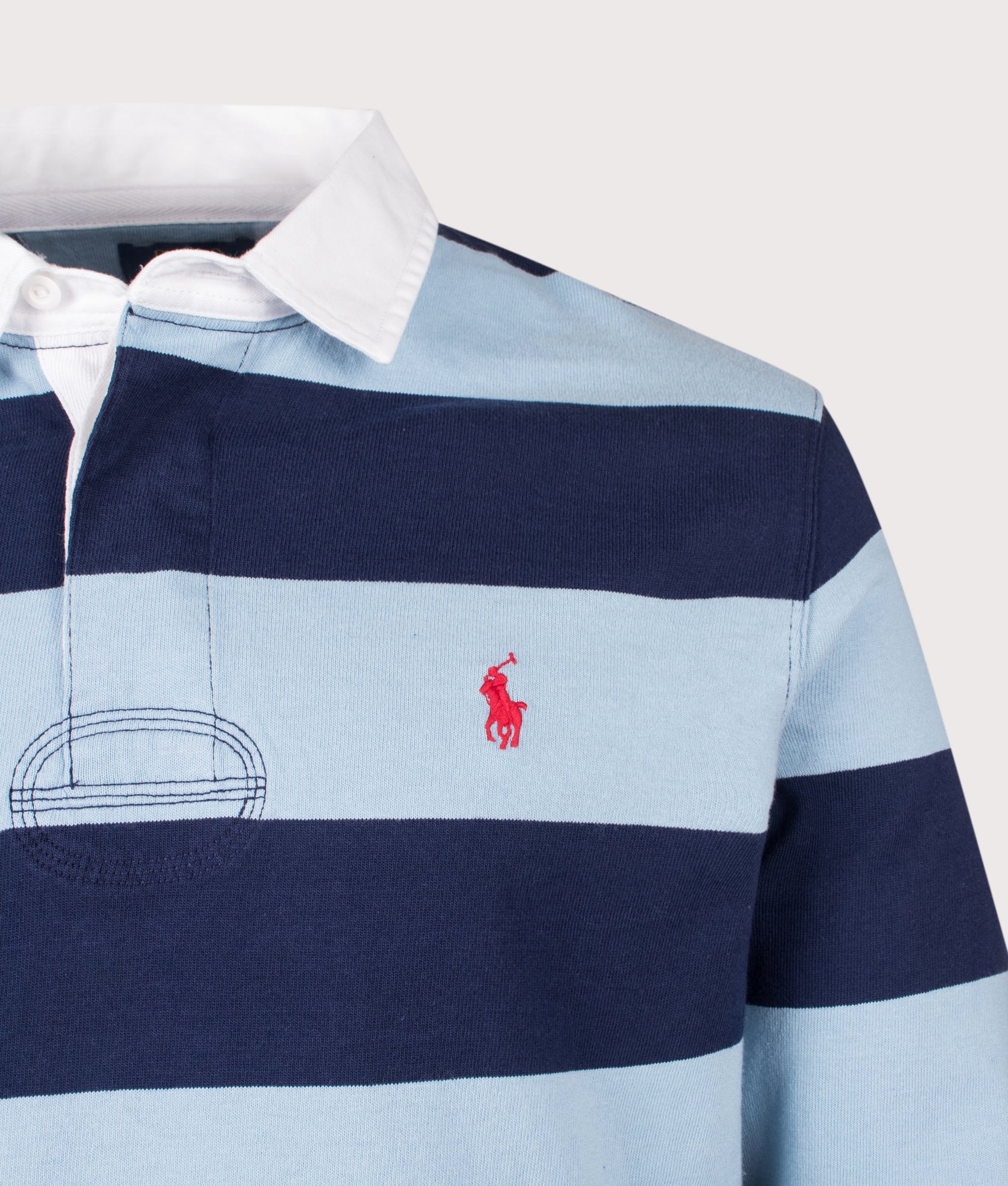 Classic Fit The Iconic Striped Rugby Shirt in Powder Blue/Newport Navy by Polo Ralph Lauren. Shot by EQVVS. Detail Shot.