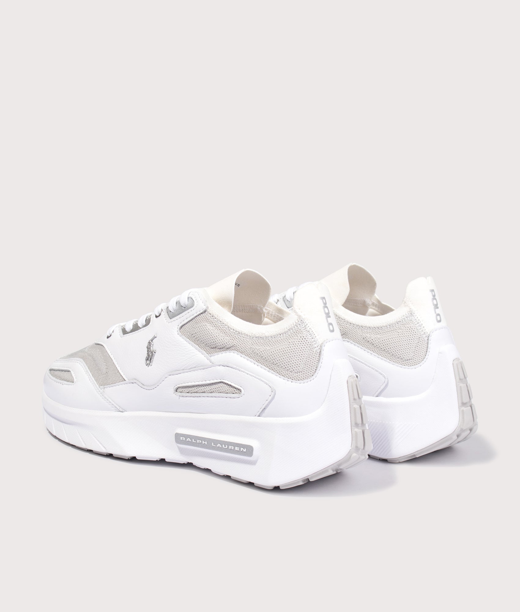 Polo Ralph Lauren Boerum Suede-Paneled Knit Trainers in Deckwash White and Grey Violet at EQVVS Menswear. Angled back shot.