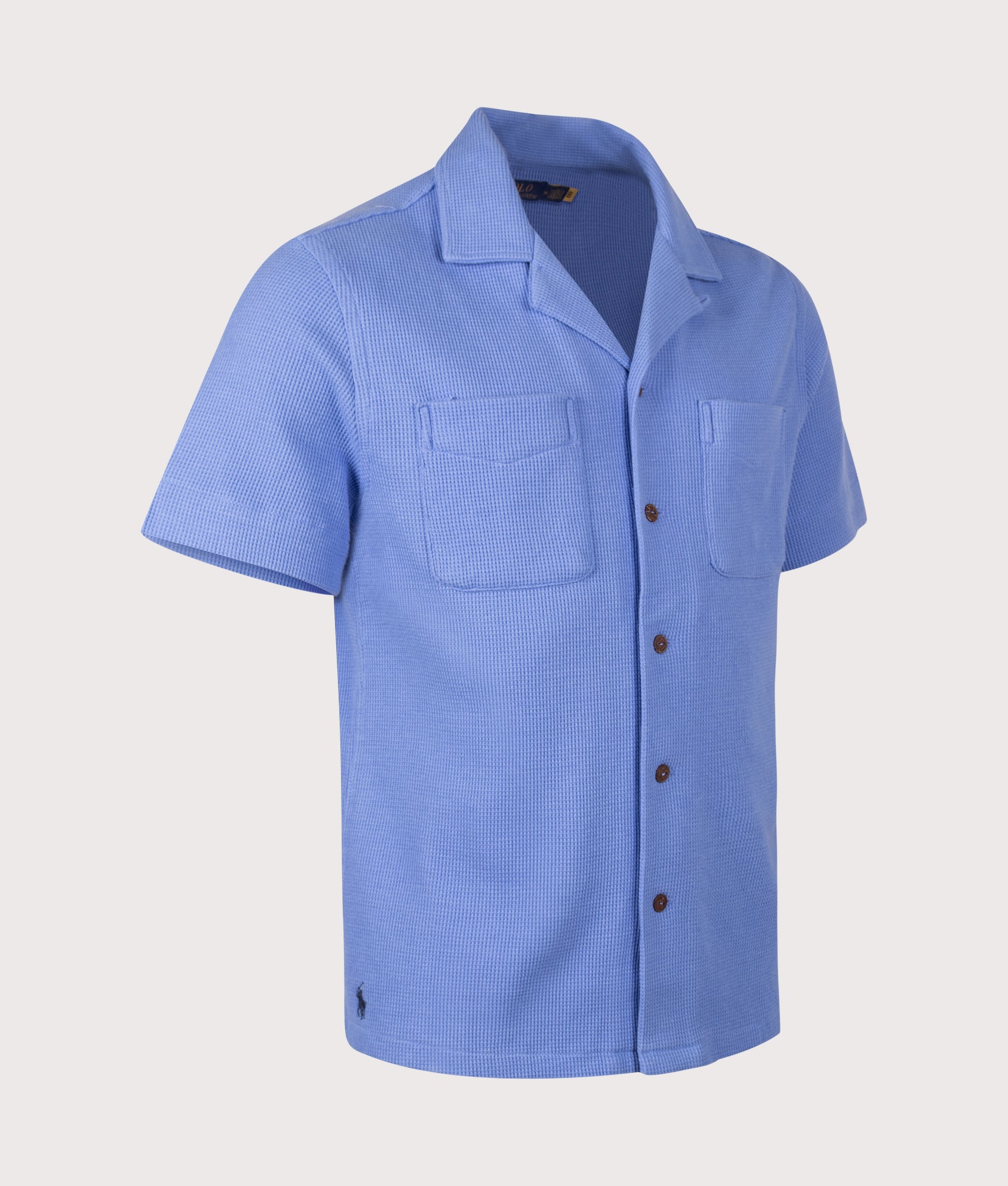 Polo Ralph Lauren Waffle-Knit Cotton-Linen Camp Shirt in Harbor Island Blue at EQVVS Menswear. Angled front shot.