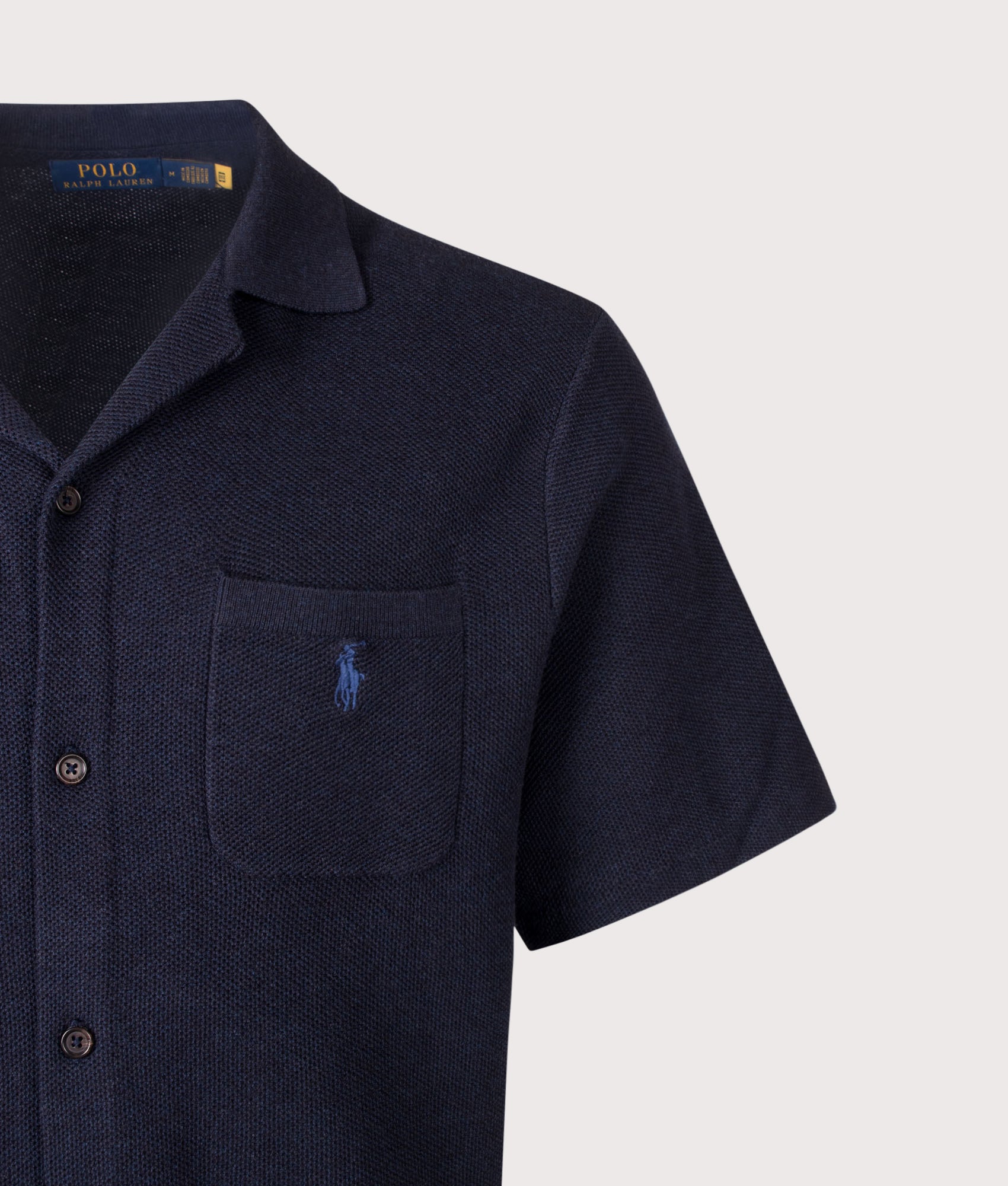 Polo Ralph Lauren Mesh Knit Cotton Short Sleeve Shirt in Navy Heather at EQVVS Menswear. Detail shot.