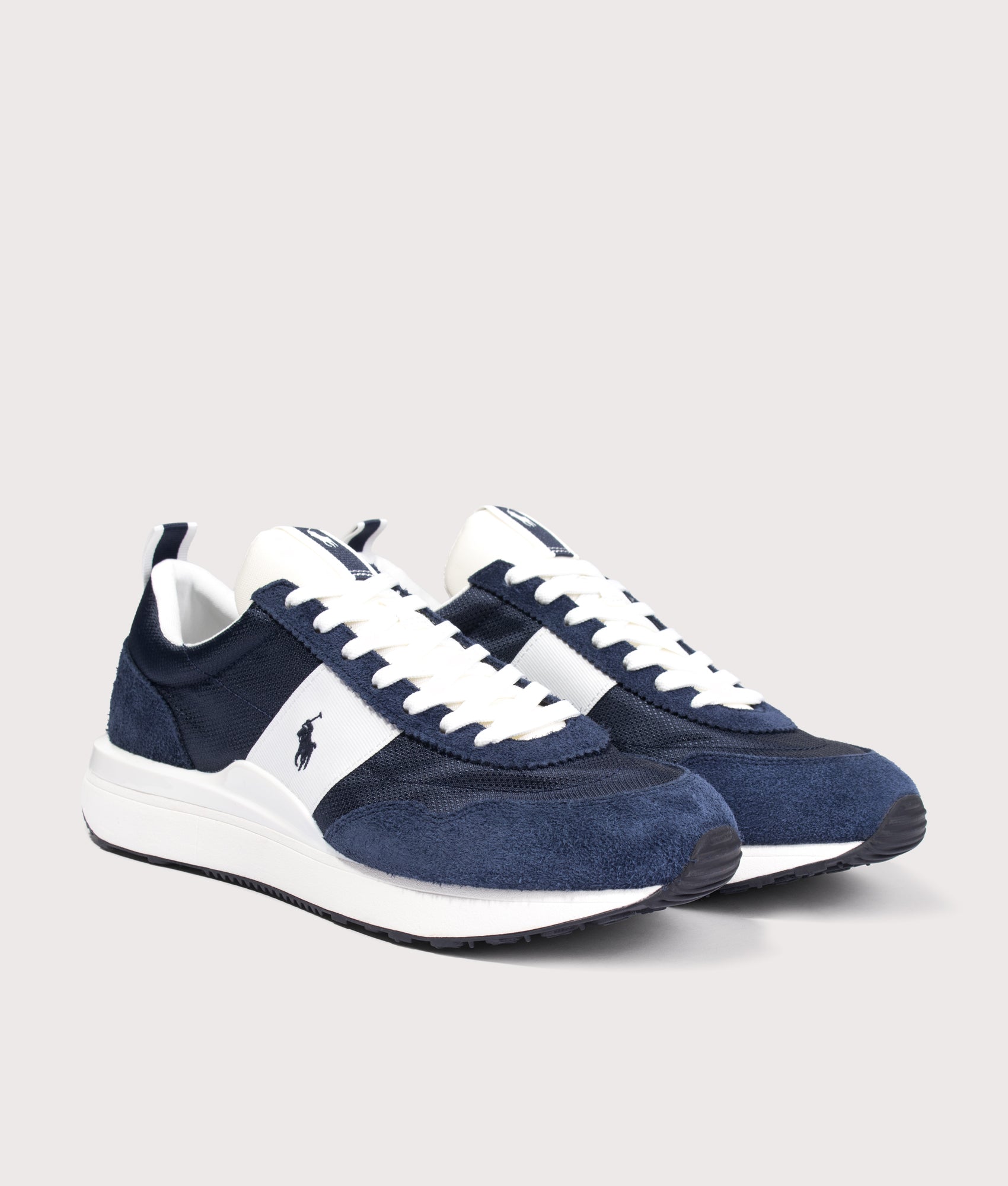Polo Ralph Lauren Train 89 Suede Oxford Trainers in Navy and Deckwash White at EQVVS Menswear. Angled front shot.