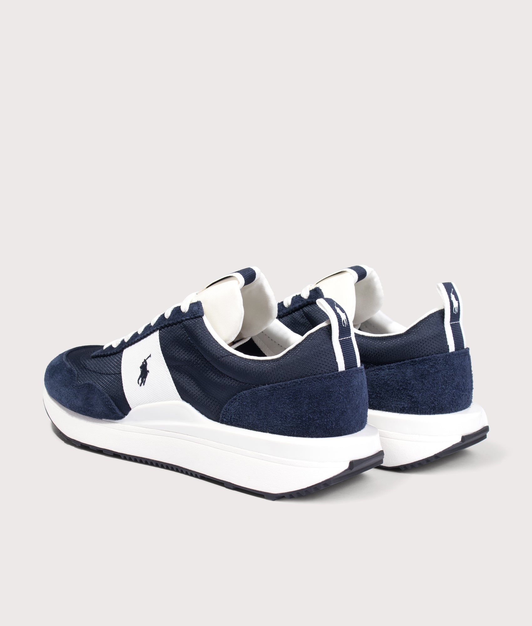 Polo Ralph Lauren Train 89 Suede Oxford Trainers in Navy and Deckwash White at EQVVS Menswear. Angled back shot.