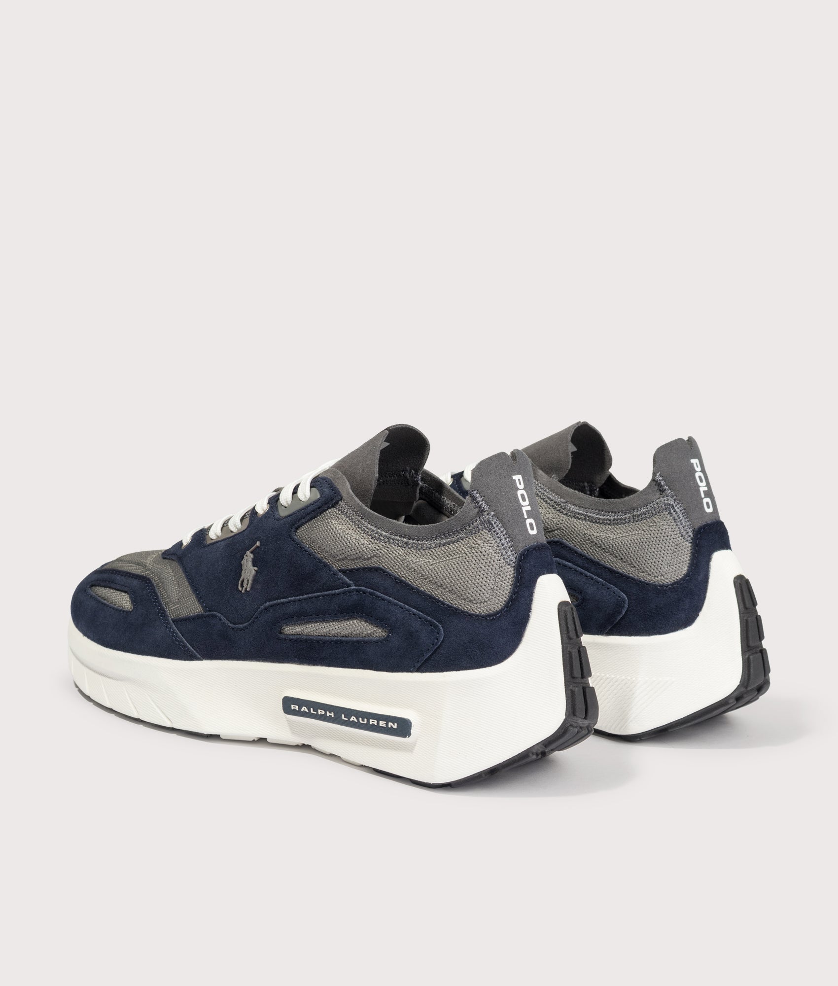Polo Ralph Lauren Boerum Suede-Paneled Knit Trainers in Hunter Navy and Dark Metal at EQVVS Menswear. Angled back shot.