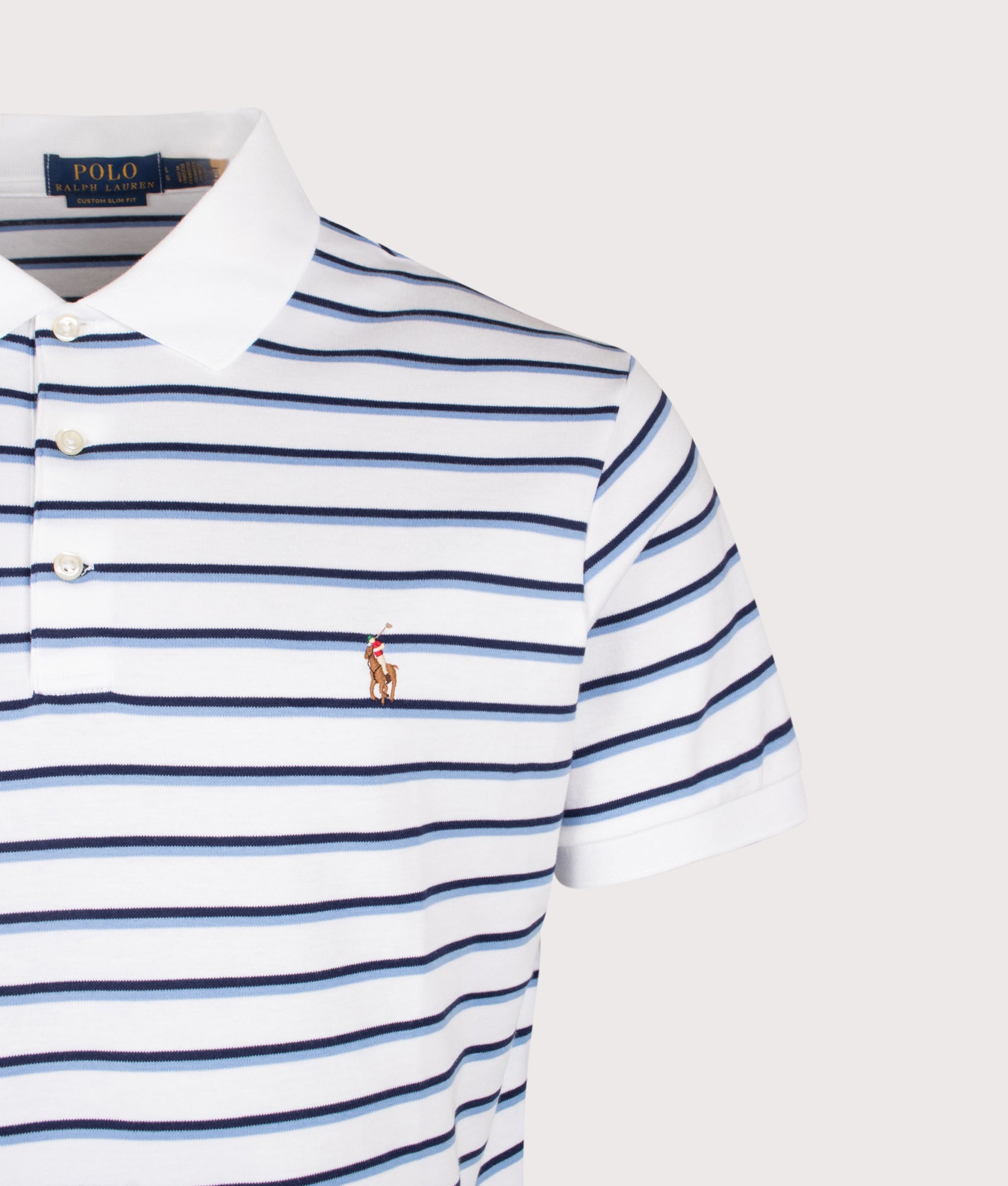 Polo Ralph Lauren Custom Slim Fit Striped Soft Cotton Polo Shirt in White Blue Multi at EQVVS Menswear. Detail shot.