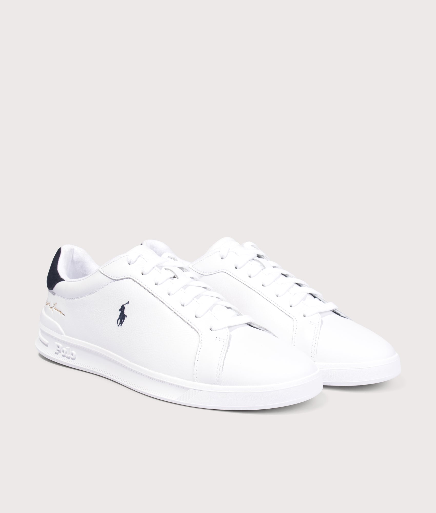 Polo Ralph Lauren Heritage Court II Leather Trainers in White and Hunter Navy at EQVVS Menswear. Angled front shot.