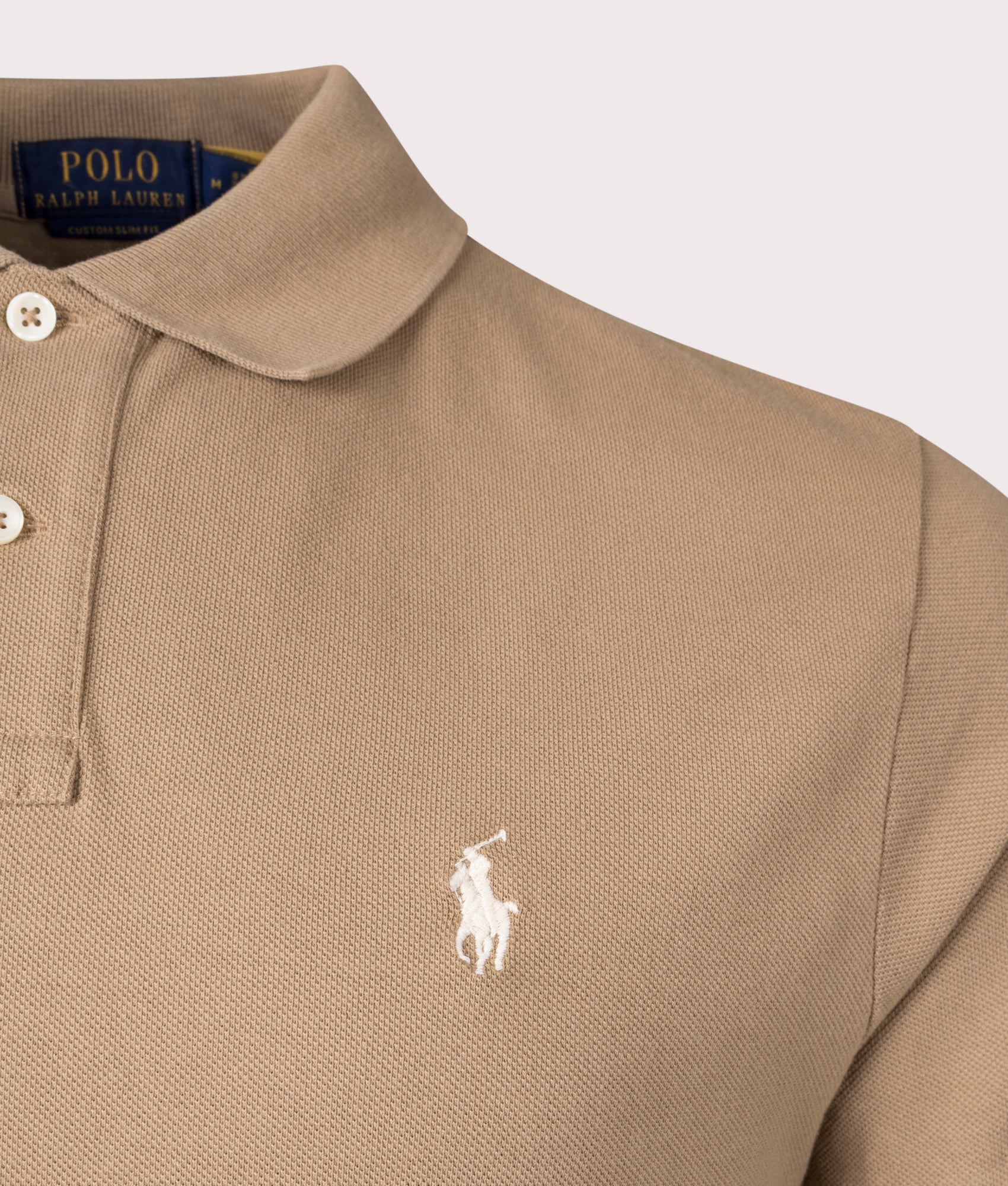 Polo Ralph Lauren Custom Slim Fit Mesh Polo Shirt in Cafe Tan at EQVVS Menswear. Detail shot.