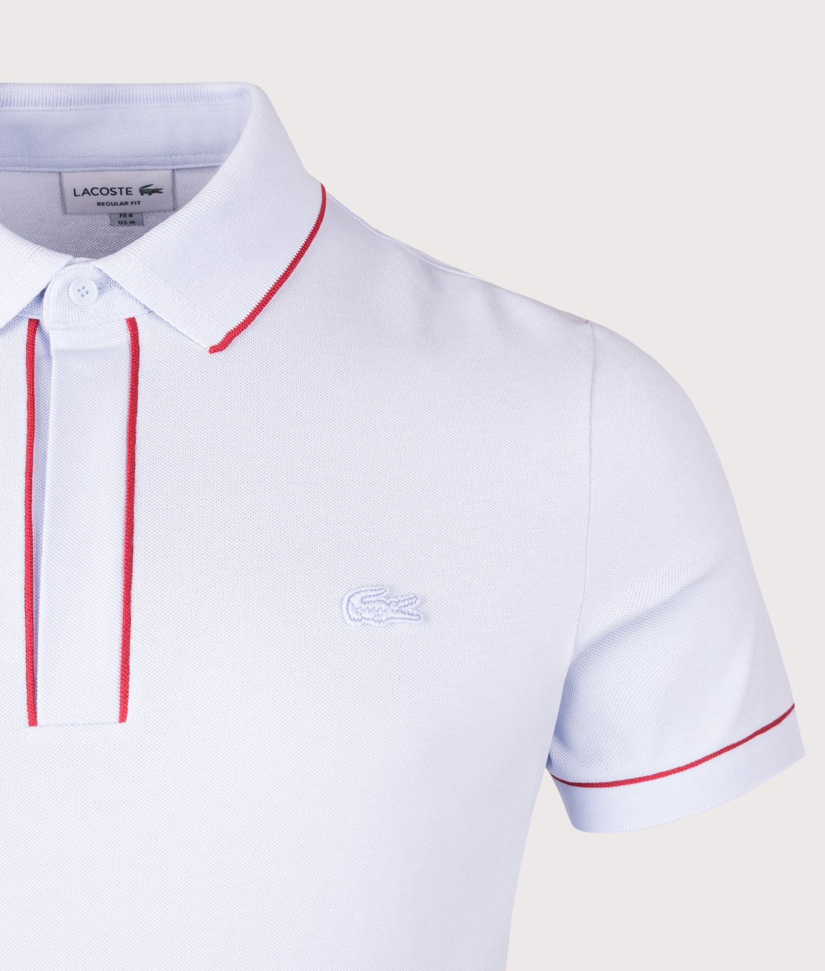 Lacoste Paris Stretch Piqué Polo Shirt in  Phoenix Blue at EQVVS Menswear. Detail shot.