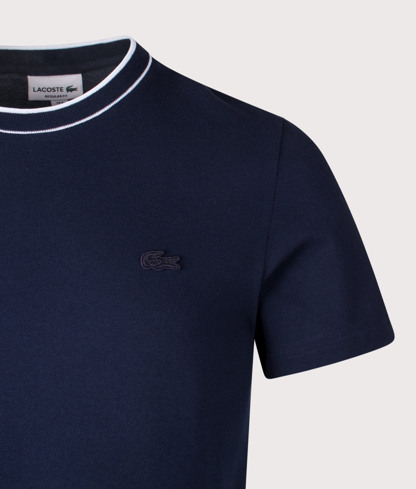 Lacoste Striped Collar T-Shirt in Navy Blue at EQVVS Menswear. Detail shot.