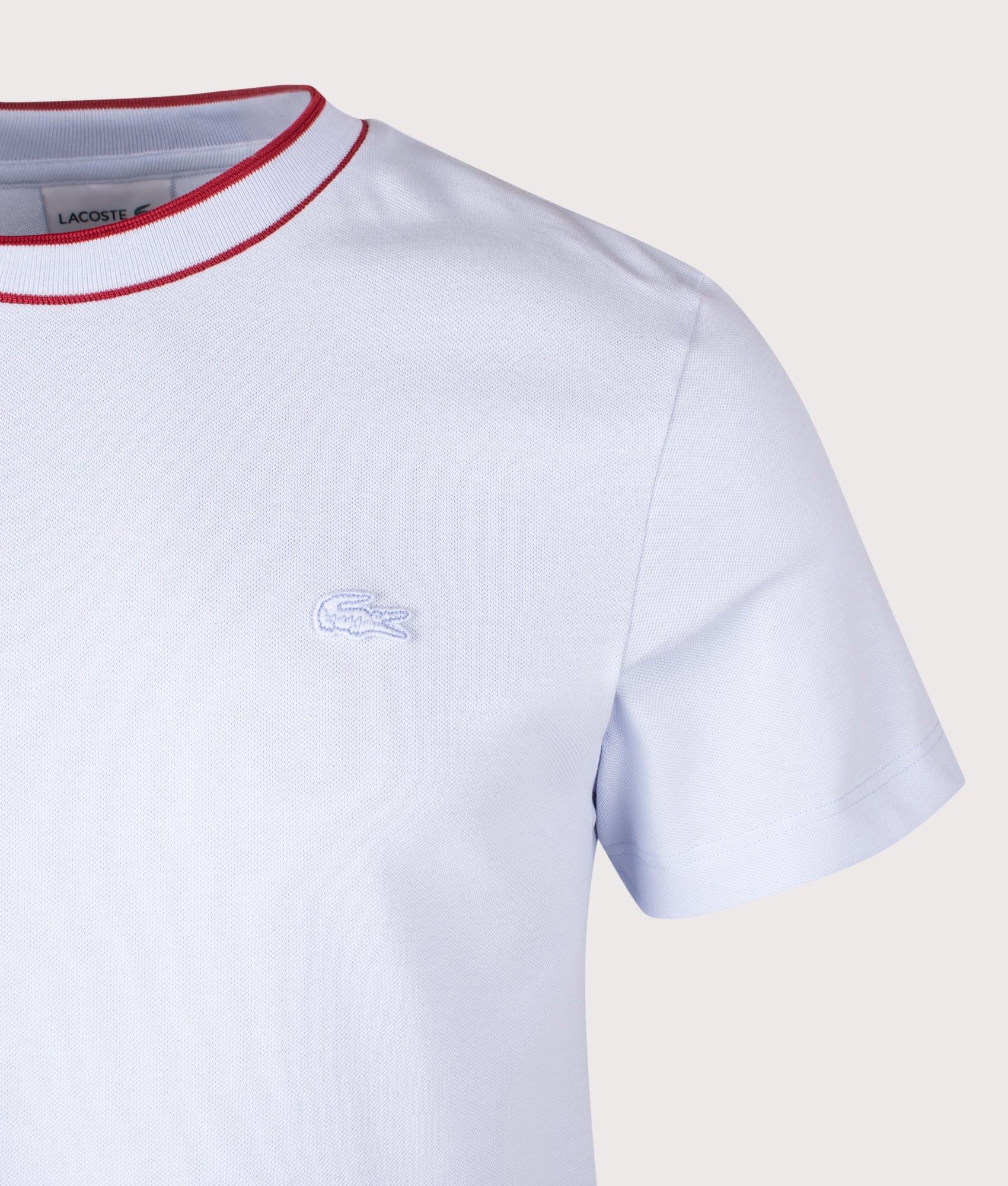 Lacoste classic Stretch Piqué Stripe Collar T-shirt in Phoenix Blue at EQVVS Menswear. Detail shot.