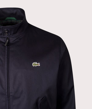 Lacoste Waterproof Twill Harrington Jacket in Abysm at EQVVS Menswear. Front detail shot.