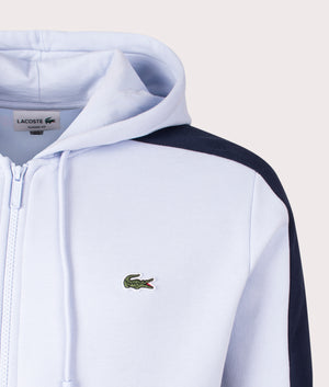 Lacoste Colourblock Hoodie in Phoenix Blue, Navy and Flour White Detail Shot at EQVVS