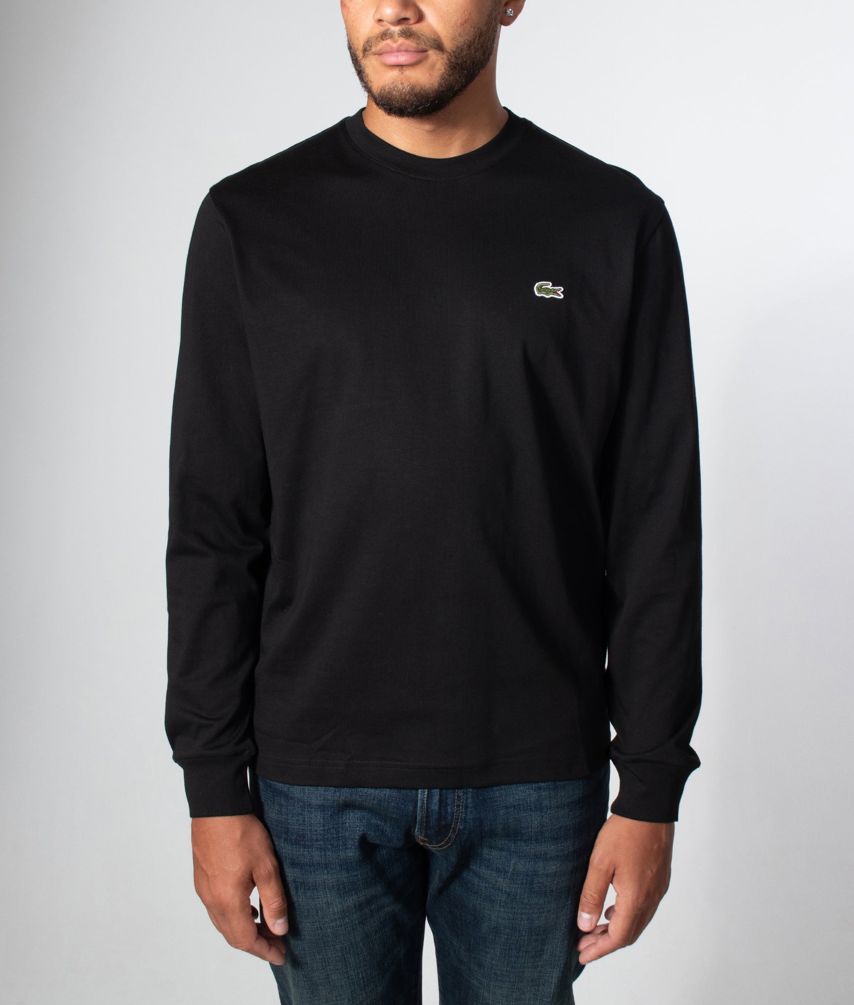 Lacoste Classic Fit Long Sleeved Cotton T-Shirt in Black at EQVVS Menswear. Model front shot.