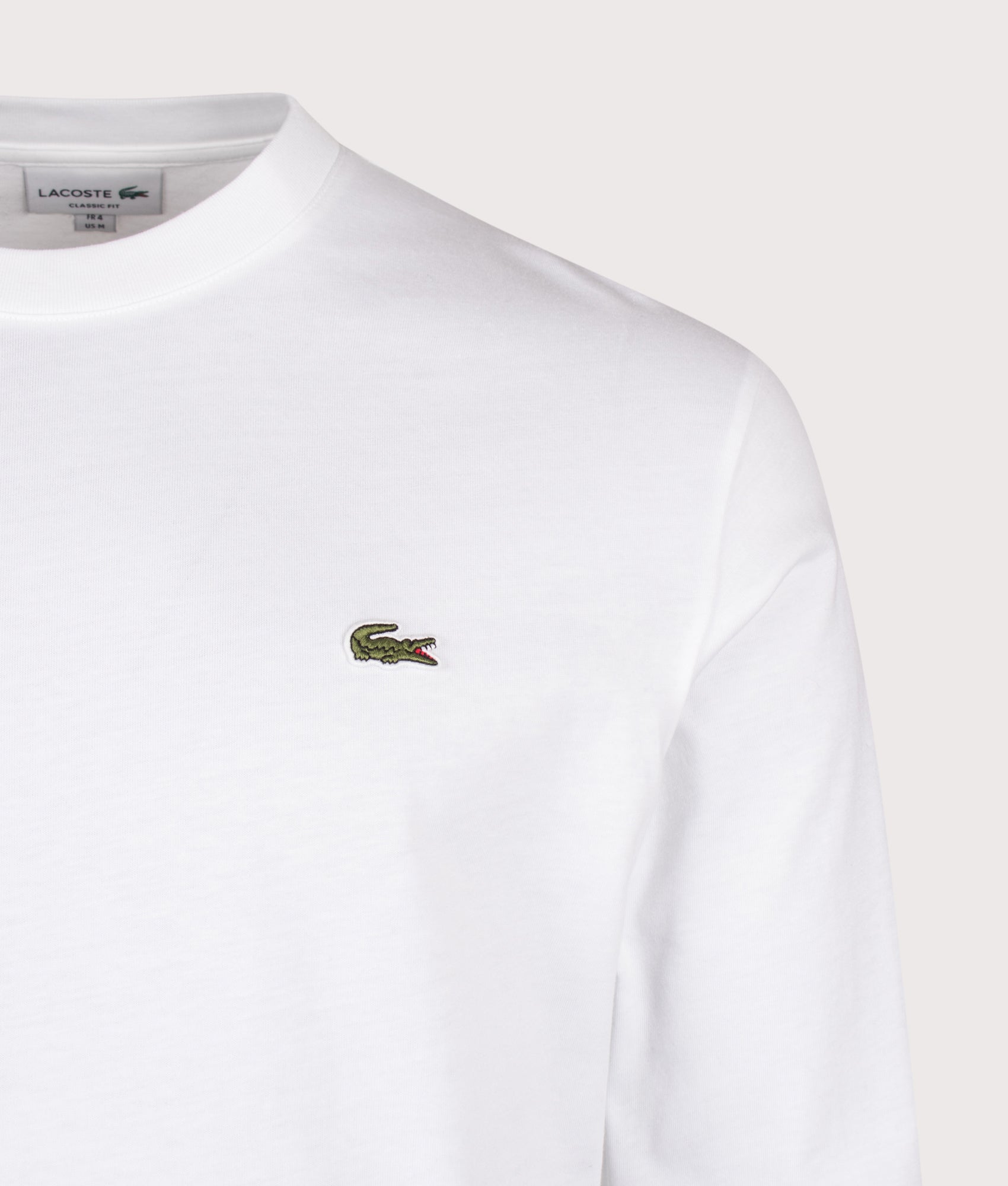 Lacoste Classic Fit Long Sleeved Cotton T-Shirt in White at EQVVS Menswear. Detail shot.