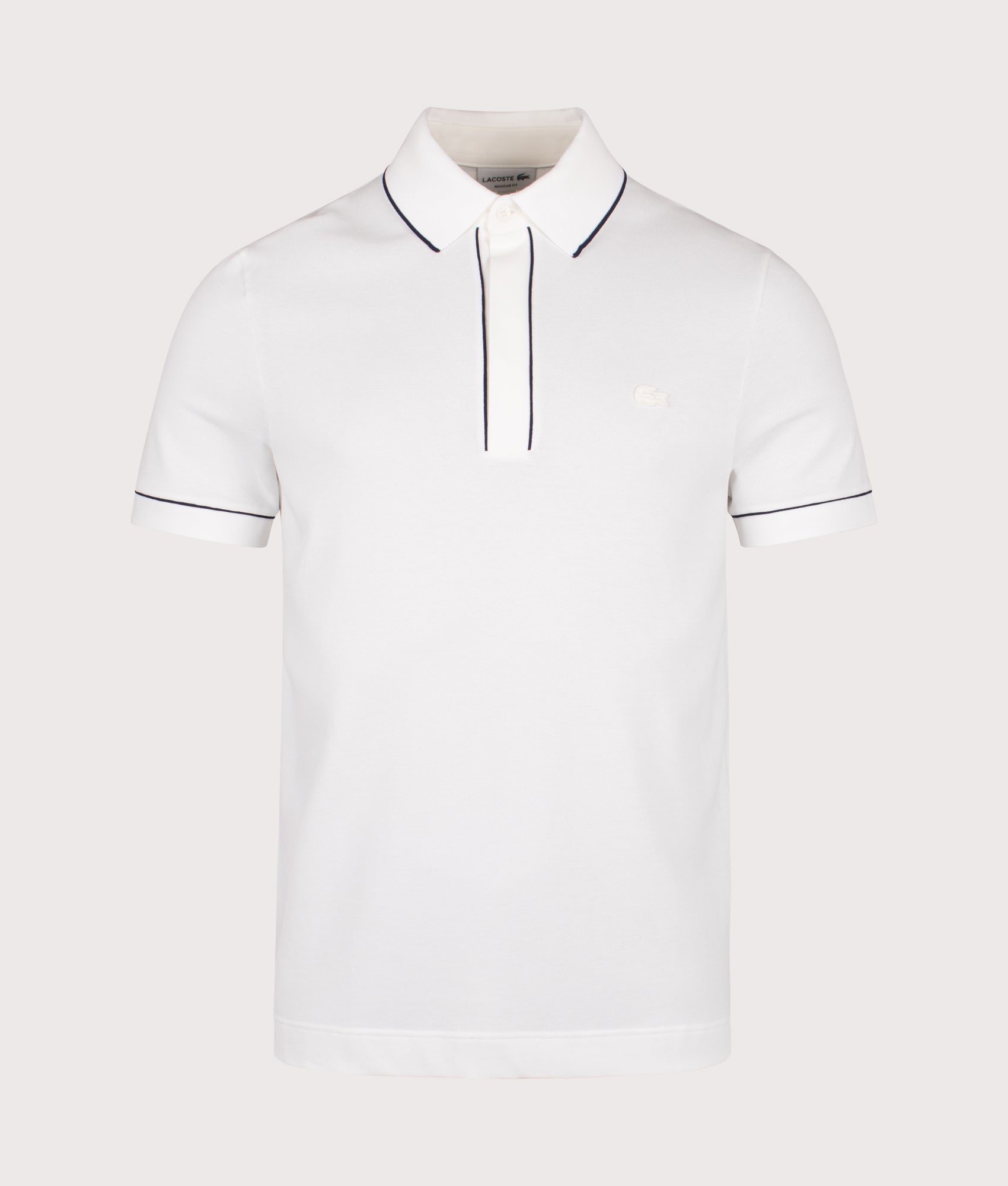 Lacoste Paris Stretch Piqué Polo Shirt in Flour at EQVVS Menswear. Front shot.