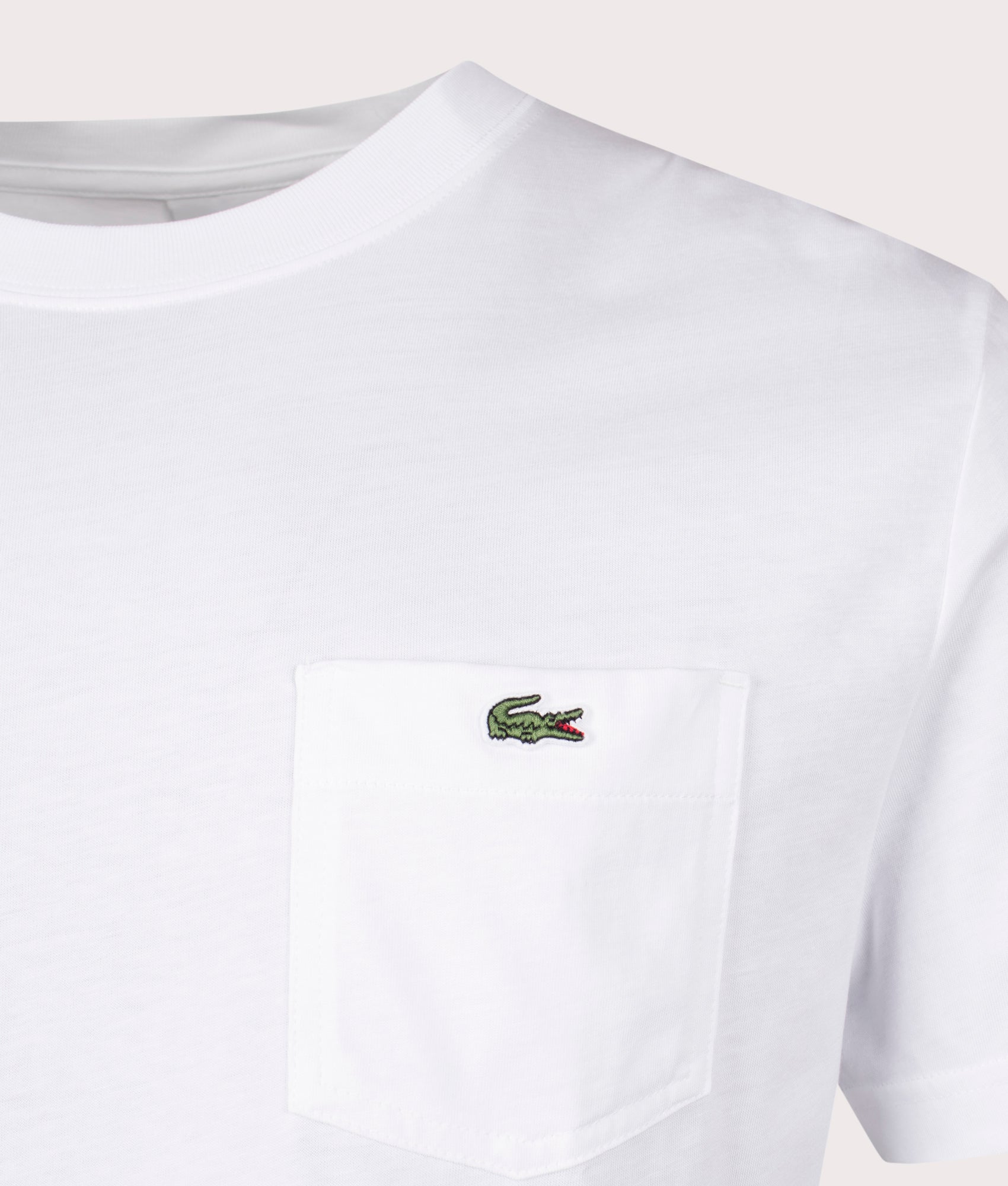 Lacoste Chest Pocket Cotton T-Shirt in White. Shot at EQVVS. Detail Shot