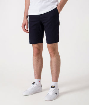 Slim Fit Bermuda Shorts. Shot by EQVVS. Front angled shot.