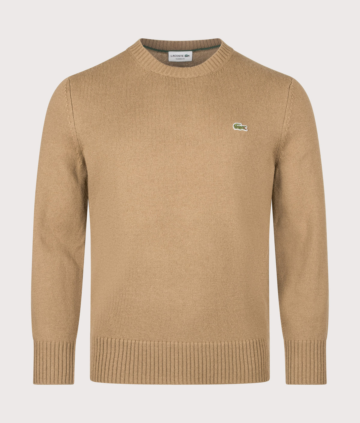 Lacoste Classic Fit Wool Crewneck Jumper in Cookie at EQVVS Menswear. Front shot.