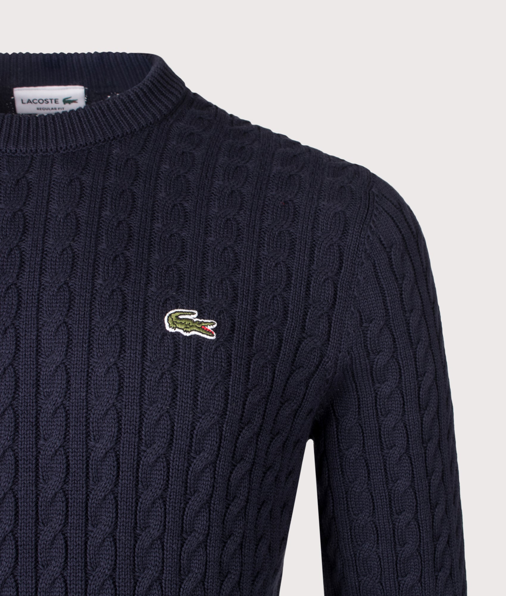 Lacoste Regular Fit Cable Knitted Jumper in Navy Blue and Green at EQVVS Menswear. Detail shot.