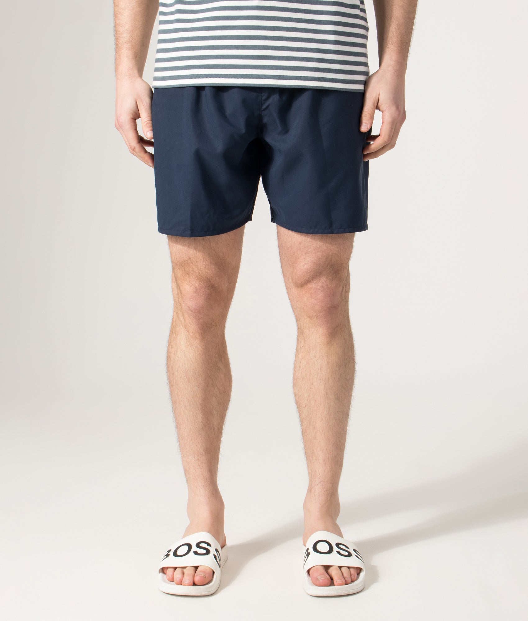 Lacoste Swim shorts in Navy and Green at EQVVS Menswear. Front shot.