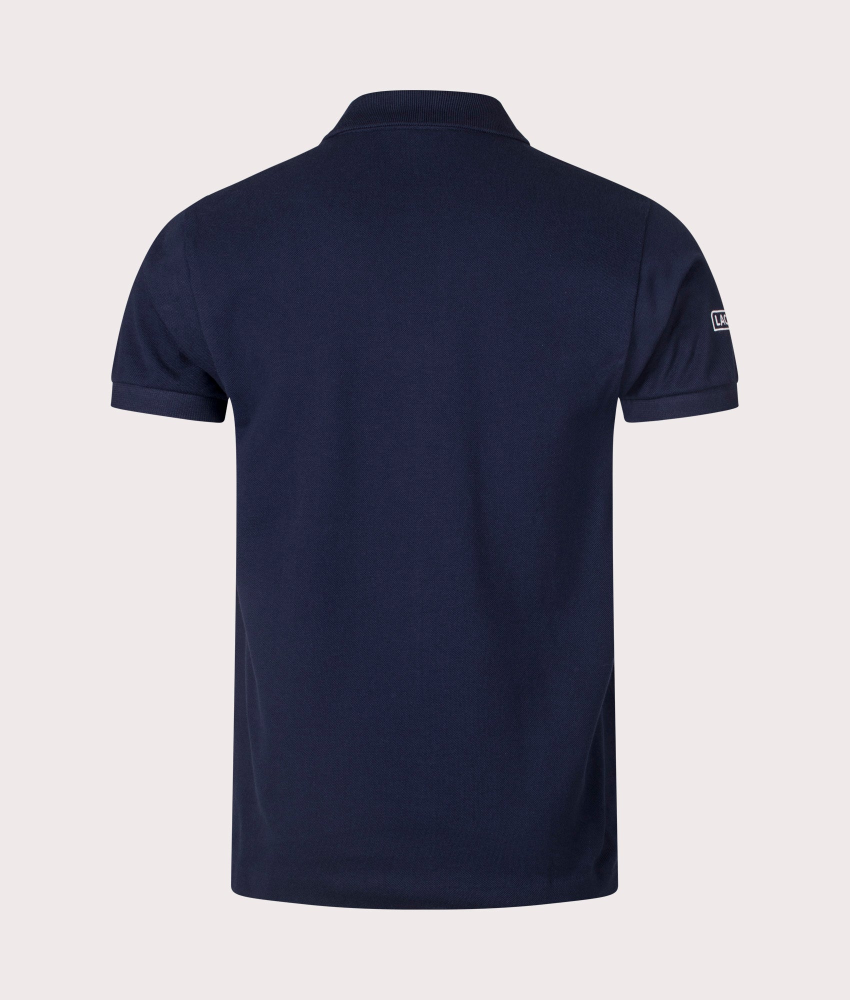 Lacoste French Made L1212 Polo Shirt in Navy at EQVVS. Back Shot.