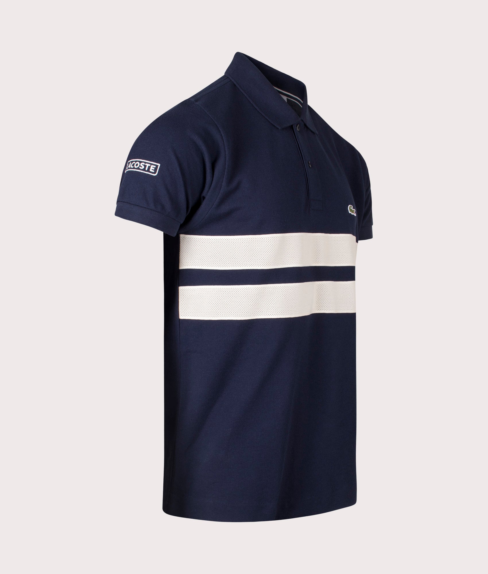 Lacoste French Made L1212 Polo Shirt in Navy at EQVVS. Angle Shot.