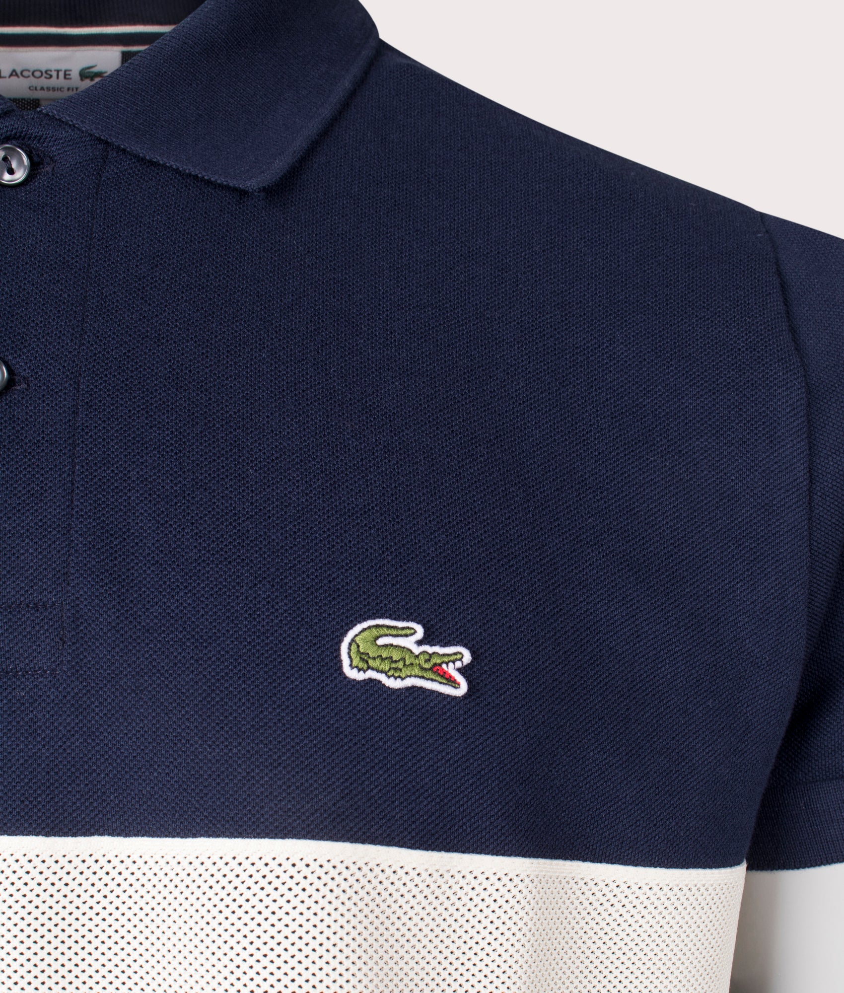 Lacoste French Made L1212 Polo Shirt in Navy at EQVVS. Front Detail Shot.