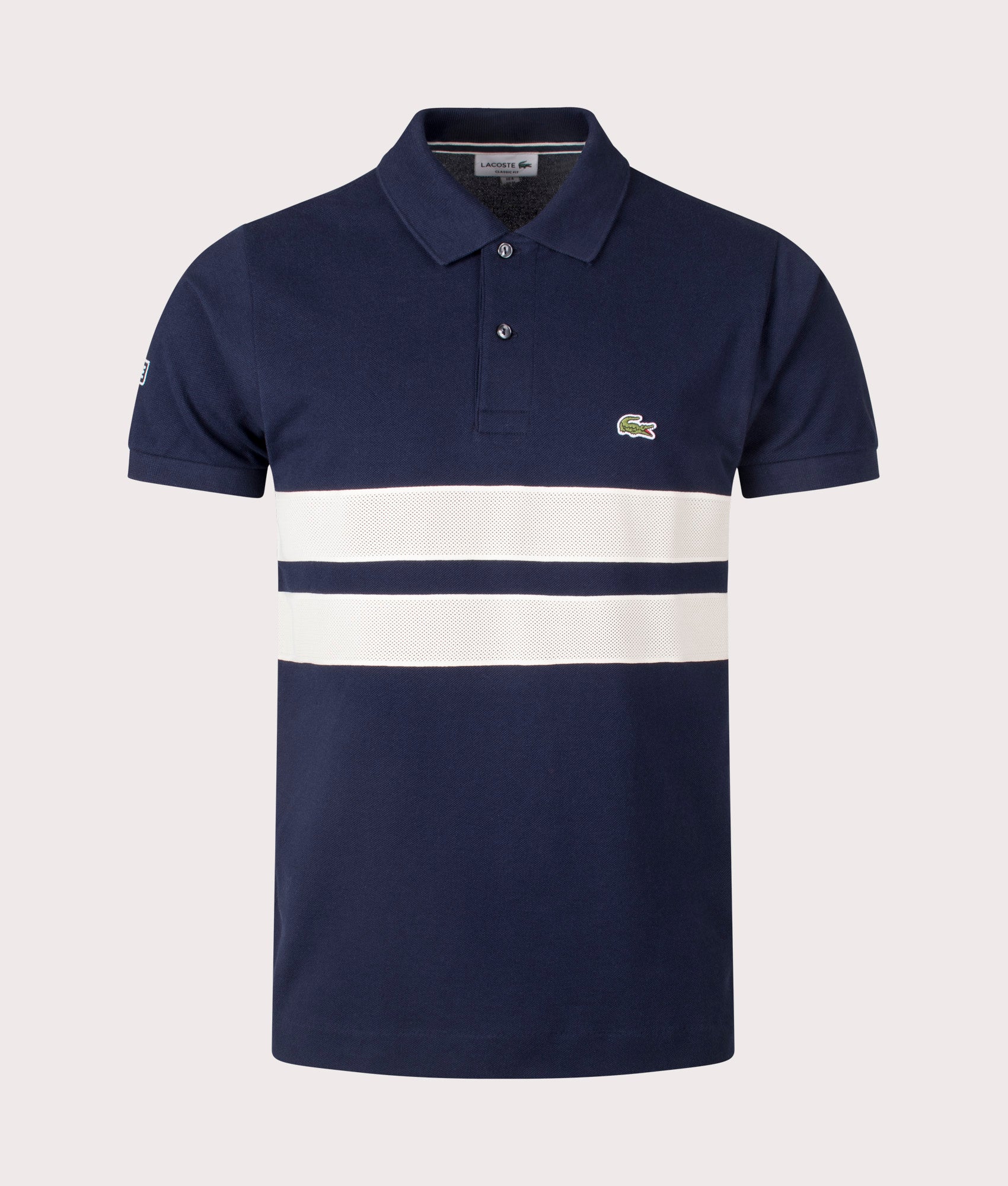 Lacoste French Made L1212 Polo Shirt in Navy at EQVVS. Front Shot.